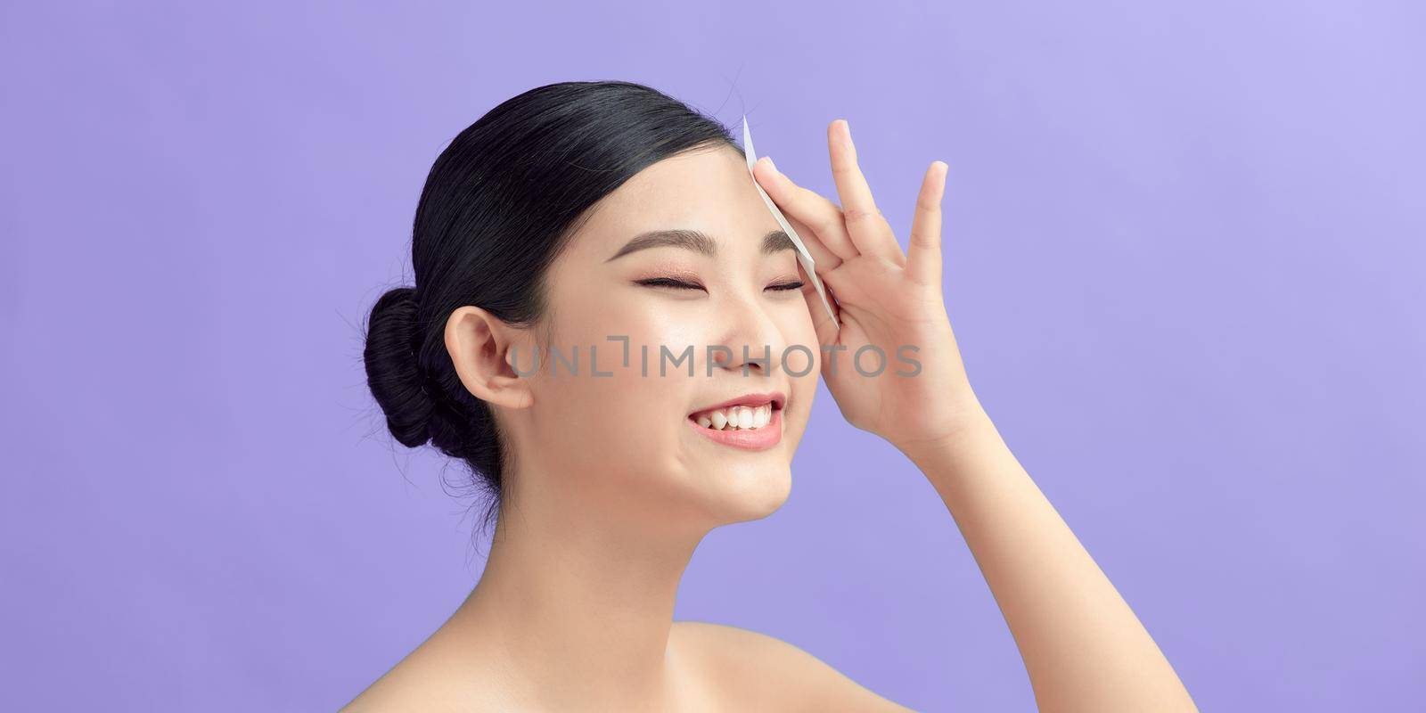Beauty. Woman Cleaning Perfect Fresh Skin With Oil Absorbing Tissue, Sheets by makidotvn