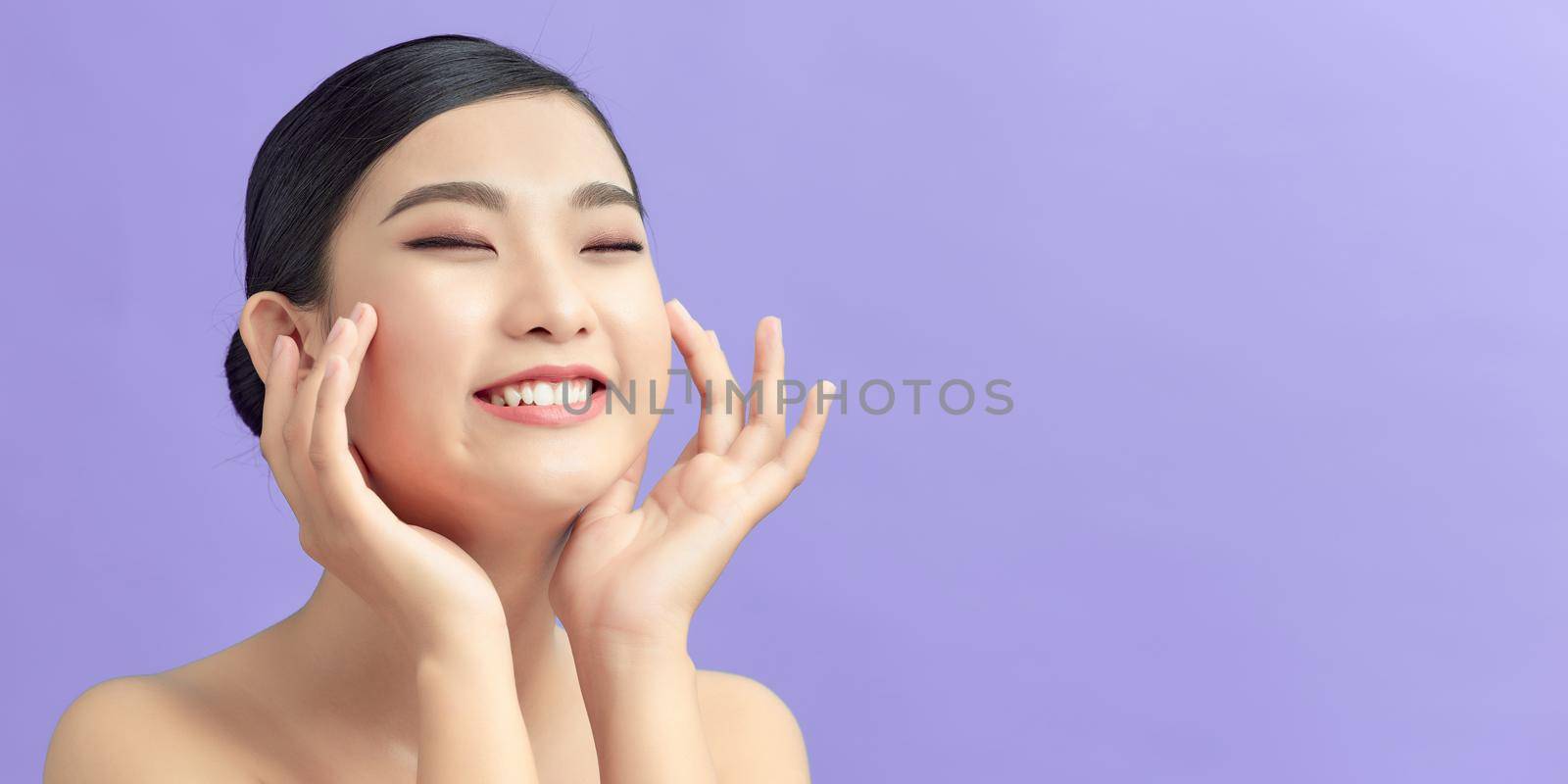 Woman with beauty face touching healthy facial skin portrait by makidotvn
