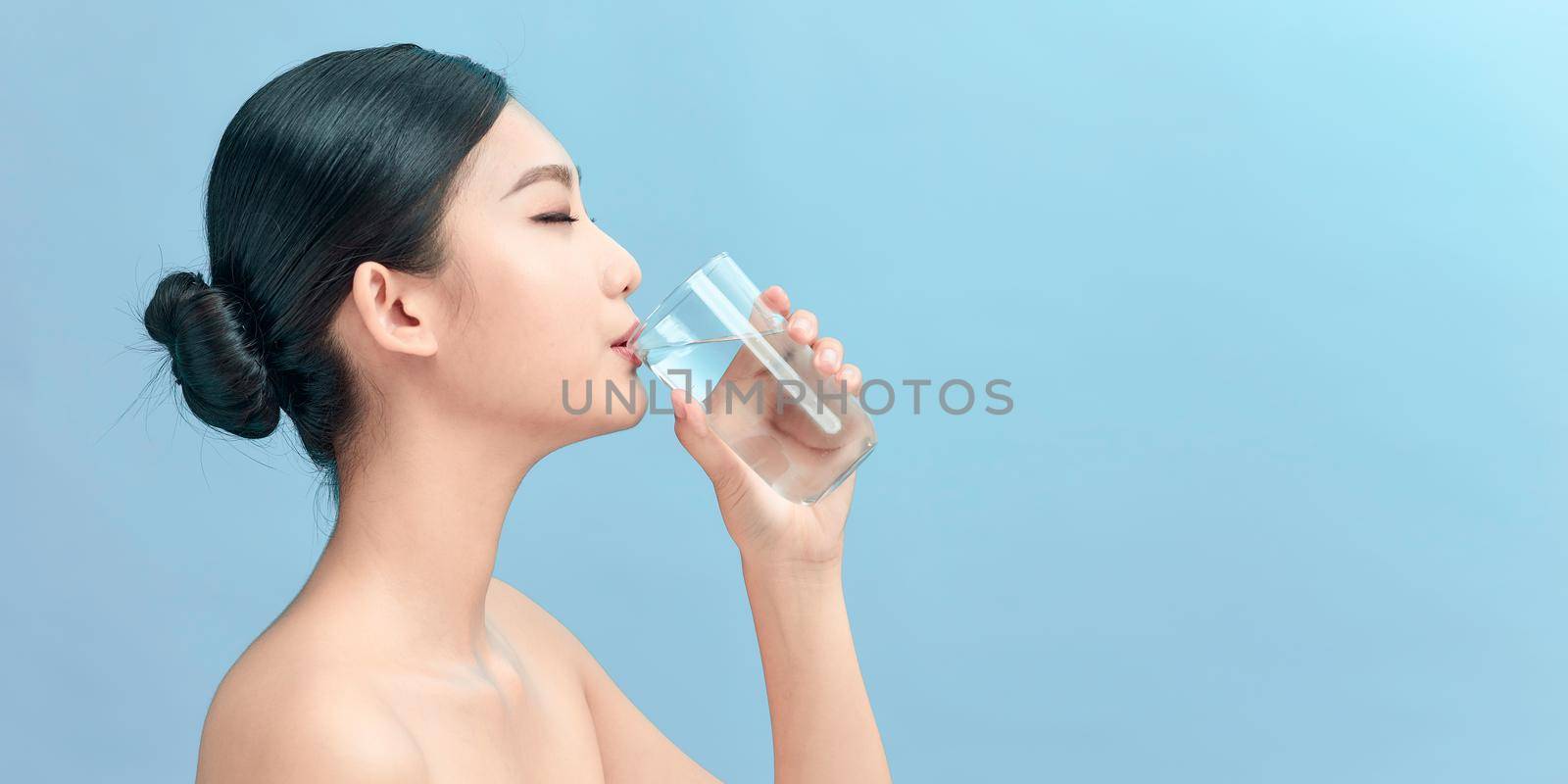 Healthy Liquid. Asian Girl Drinking Clean Water From Glass