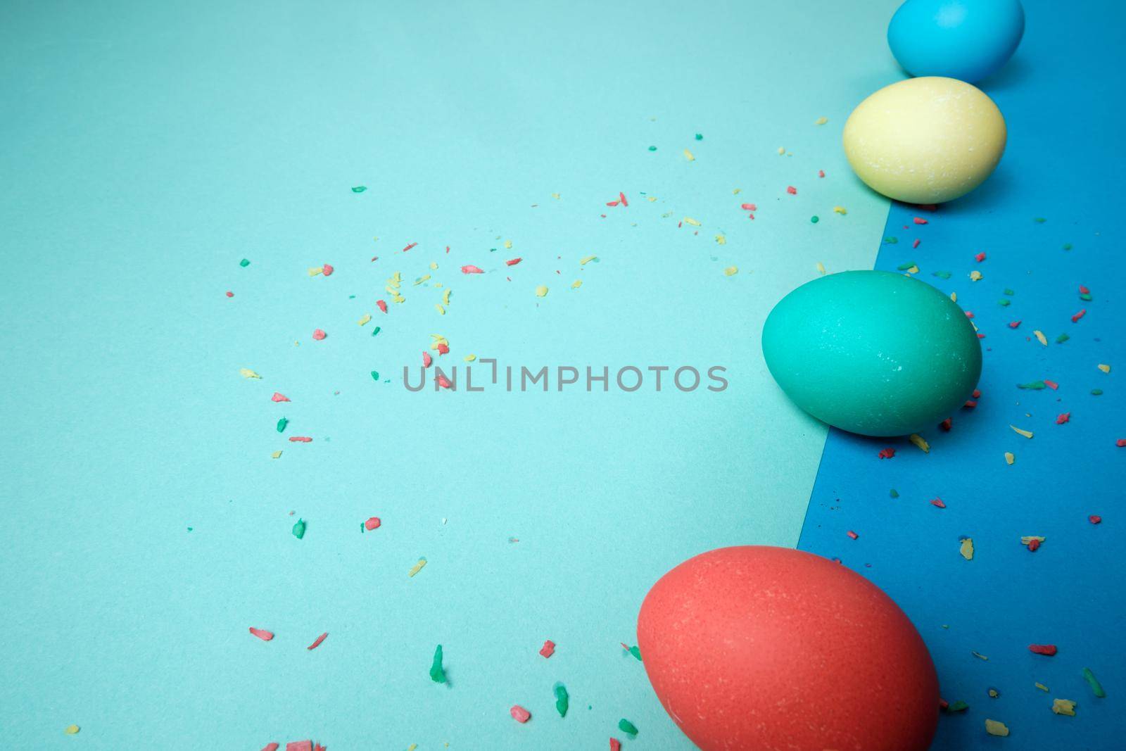 Colored chicken eggs. Easter holiday. Abstraction. Place for text.