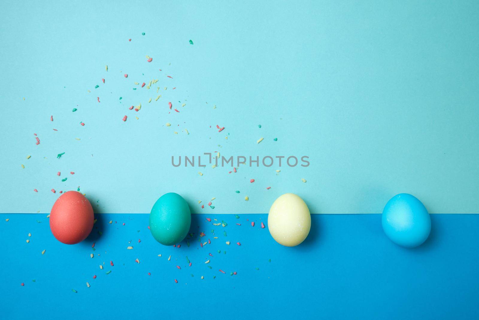 Colored chicken eggs. Easter holiday. Abstraction. Place for text.