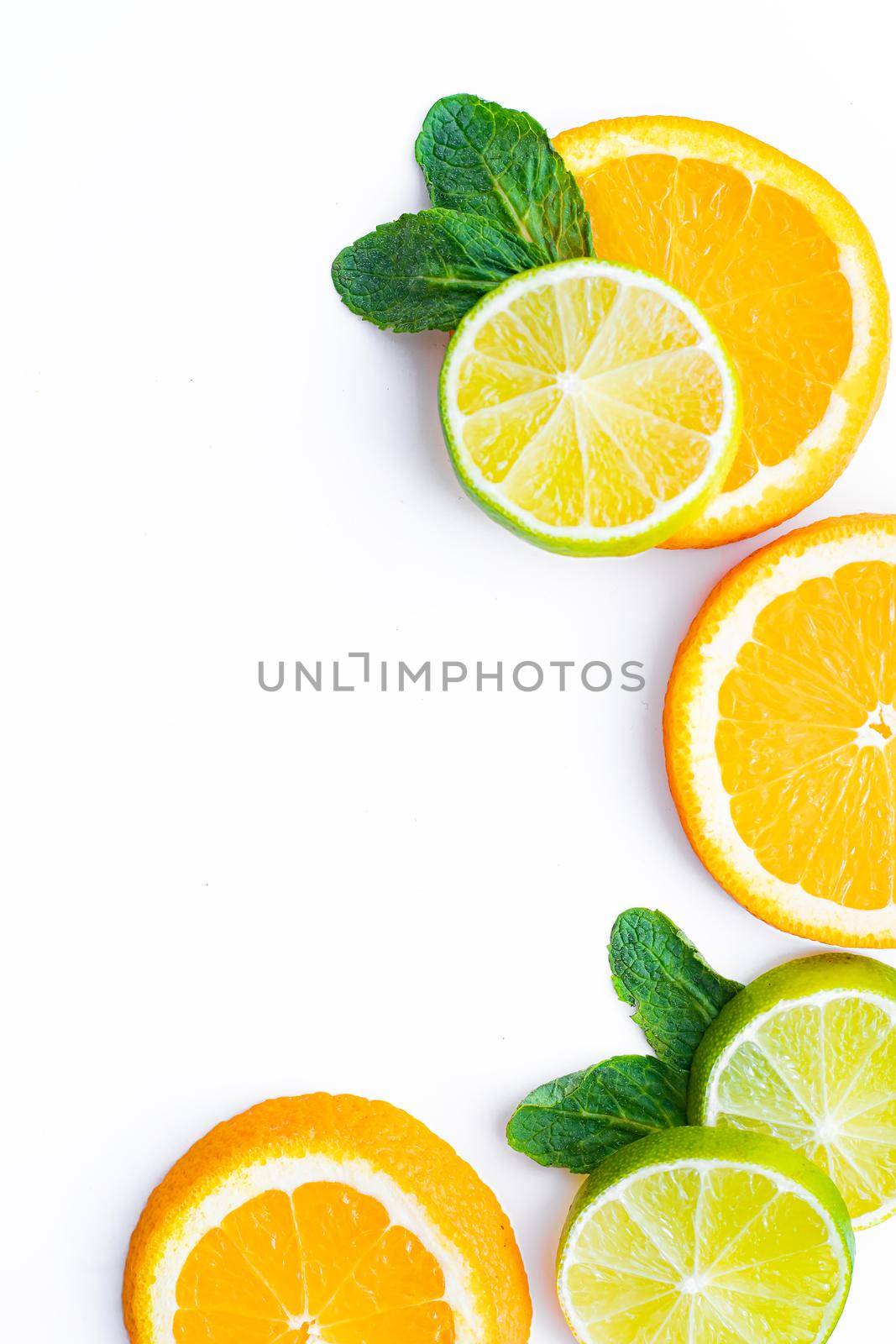 Citrus fruits on a white background are cut . Colored fruits. The citrus family. citrus sliced layout top view on a white background. An article about healthy eating. Keto diet. Fruit food.