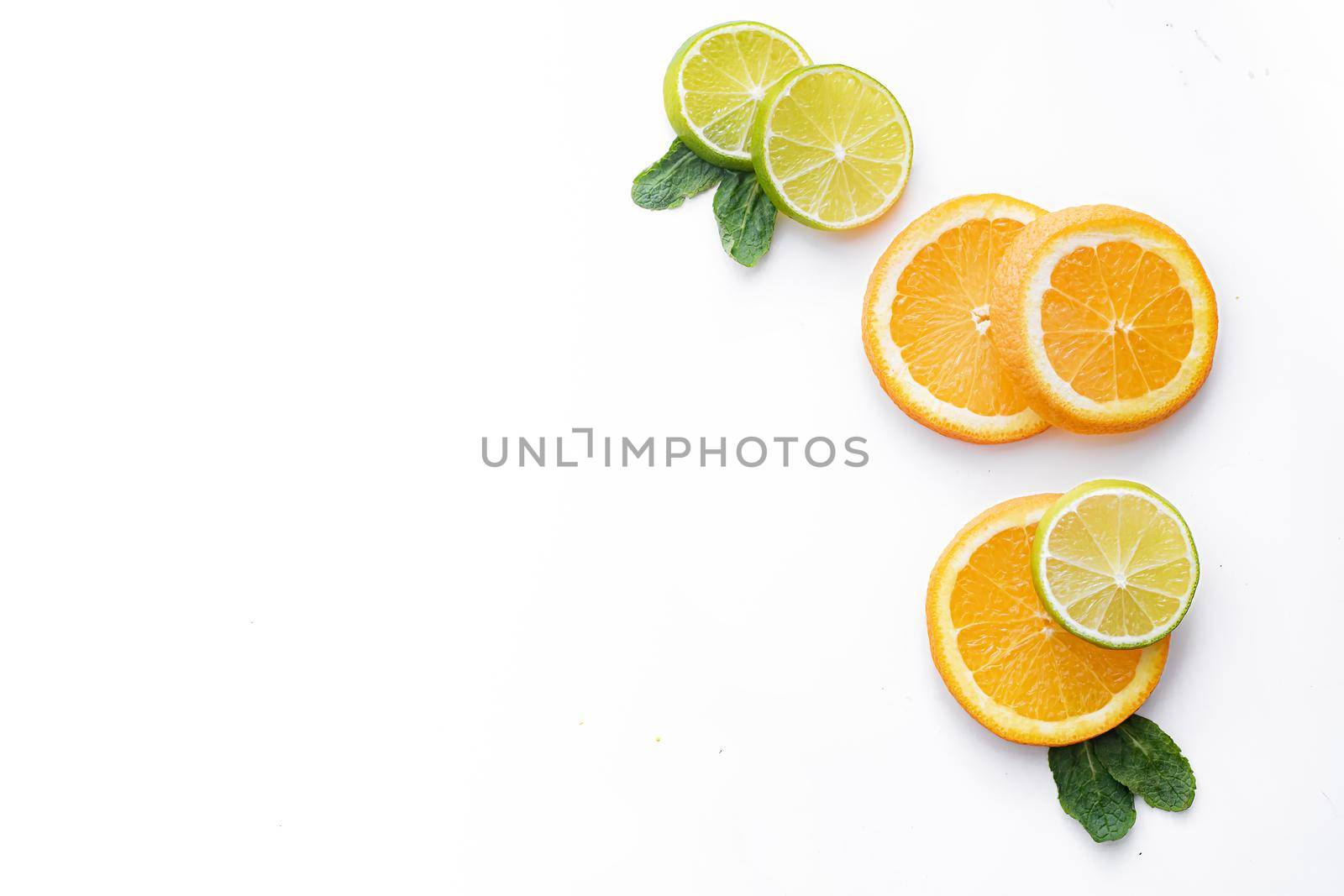 Citrus fruits on a white background are cut . Colored fruits. The citrus family. citrus sliced layout top view on a white background. An article about healthy eating. Keto diet. Fruit food.