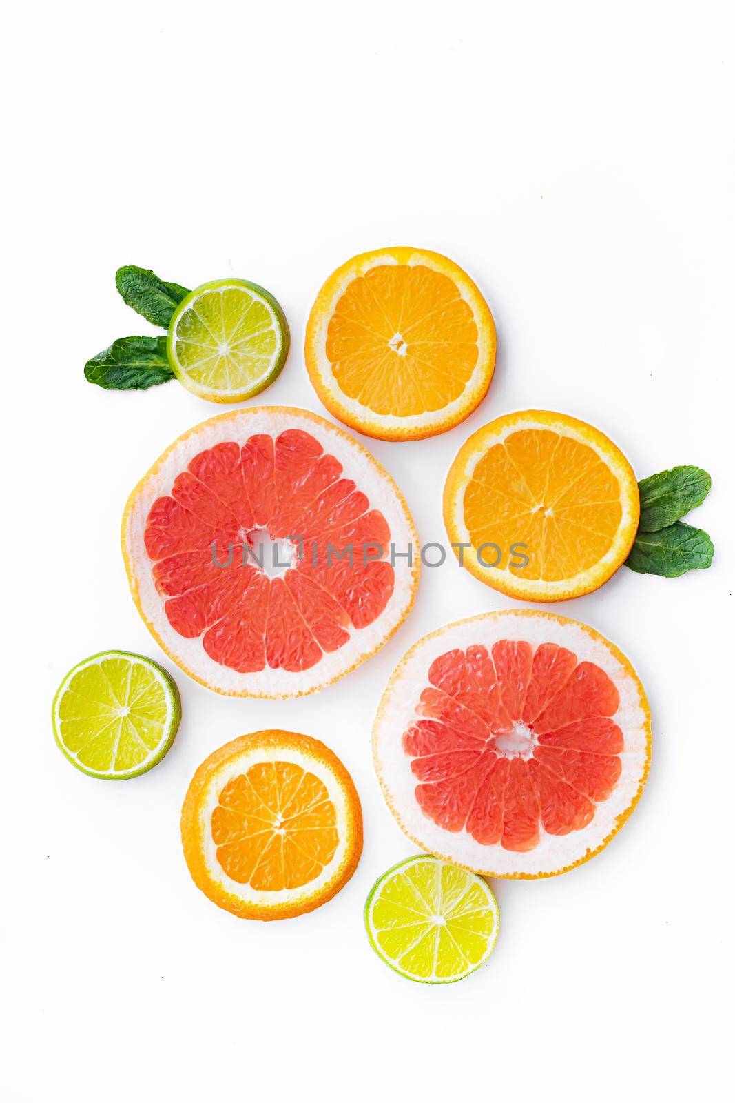 Citrus fruits on a white background are cut . Colored fruits. The citrus family. citrus sliced layout top view on a white background. An article about healthy eating. Keto diet. Fruit food.