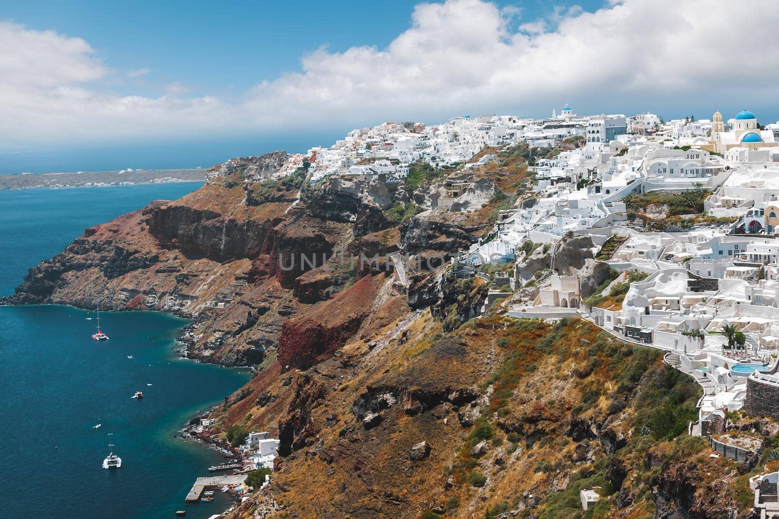 Panoramic view  of Oia ,  a small village on the edge of the caldera, by day, Santorini, Greece