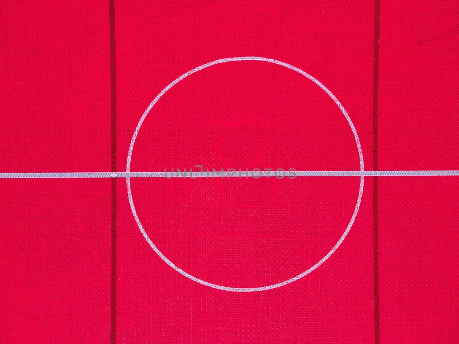 Plastic outdoor basketball court  floor, detail. Outdoor sport ground with red surface for playing basketball  in urban area, above.