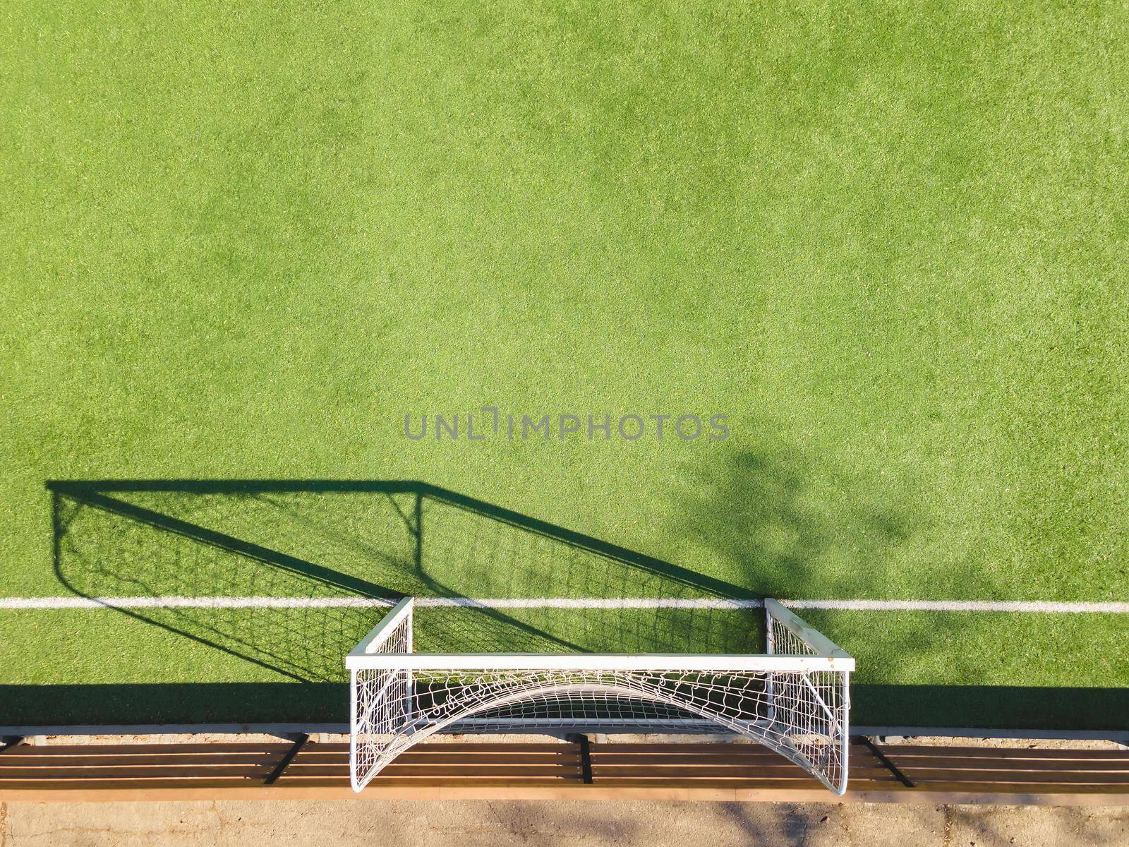 Green Soccer Court Detail .Outdoor sport ground with green surface for playing football  or soccer  in urban area, detail. by Slast20