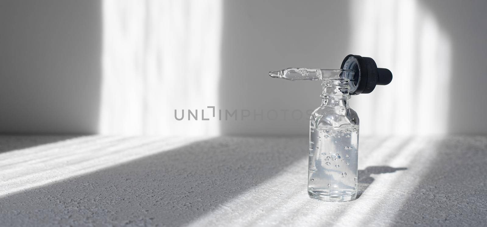 Hyaluronic acid in a bottle on a white background . Cosmetology. Cosmetology bottles.Spa. Spa treatments. Skin care. Youth. Women's skin. Article about the choice of hyaluronic acid. Article about skin care . Copy space .