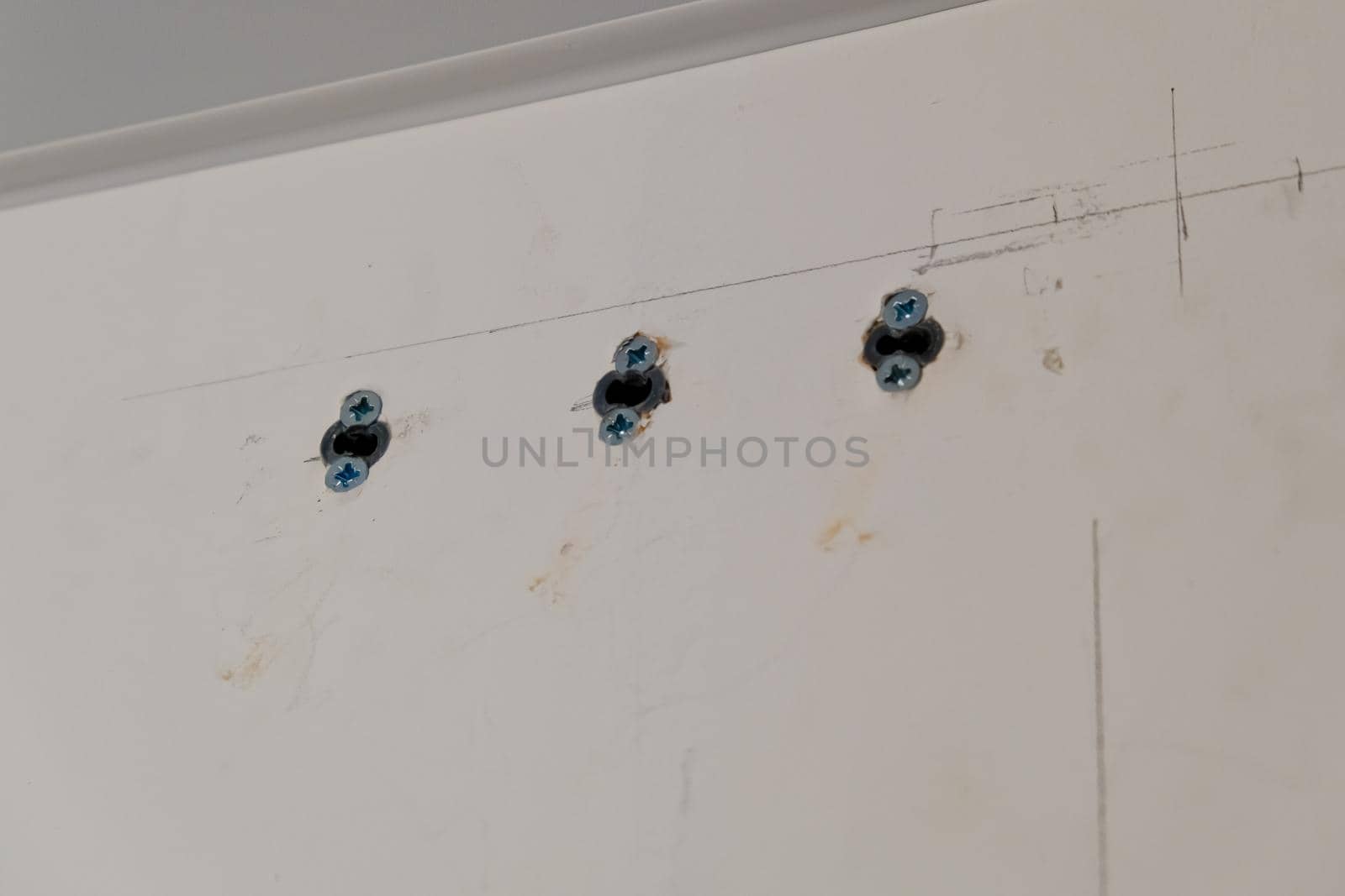 An example of how you can fix the dowels in the wall. Close up. Selective focus.
