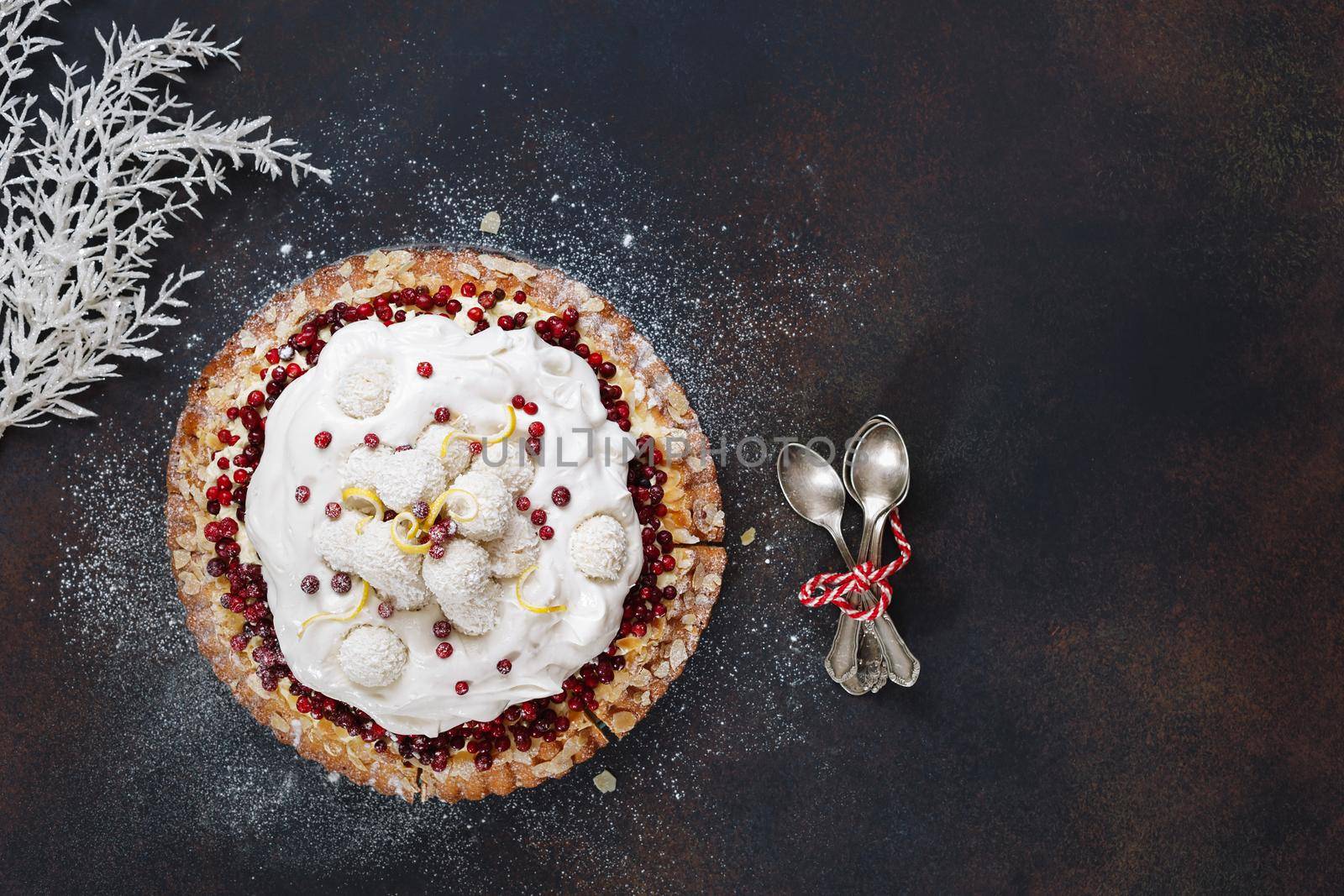 Cranberry tart. Delicious brown butter cranberry tart with fresh cranberries and coconut balls on top. Top view, blank space, rustic background by Slast20