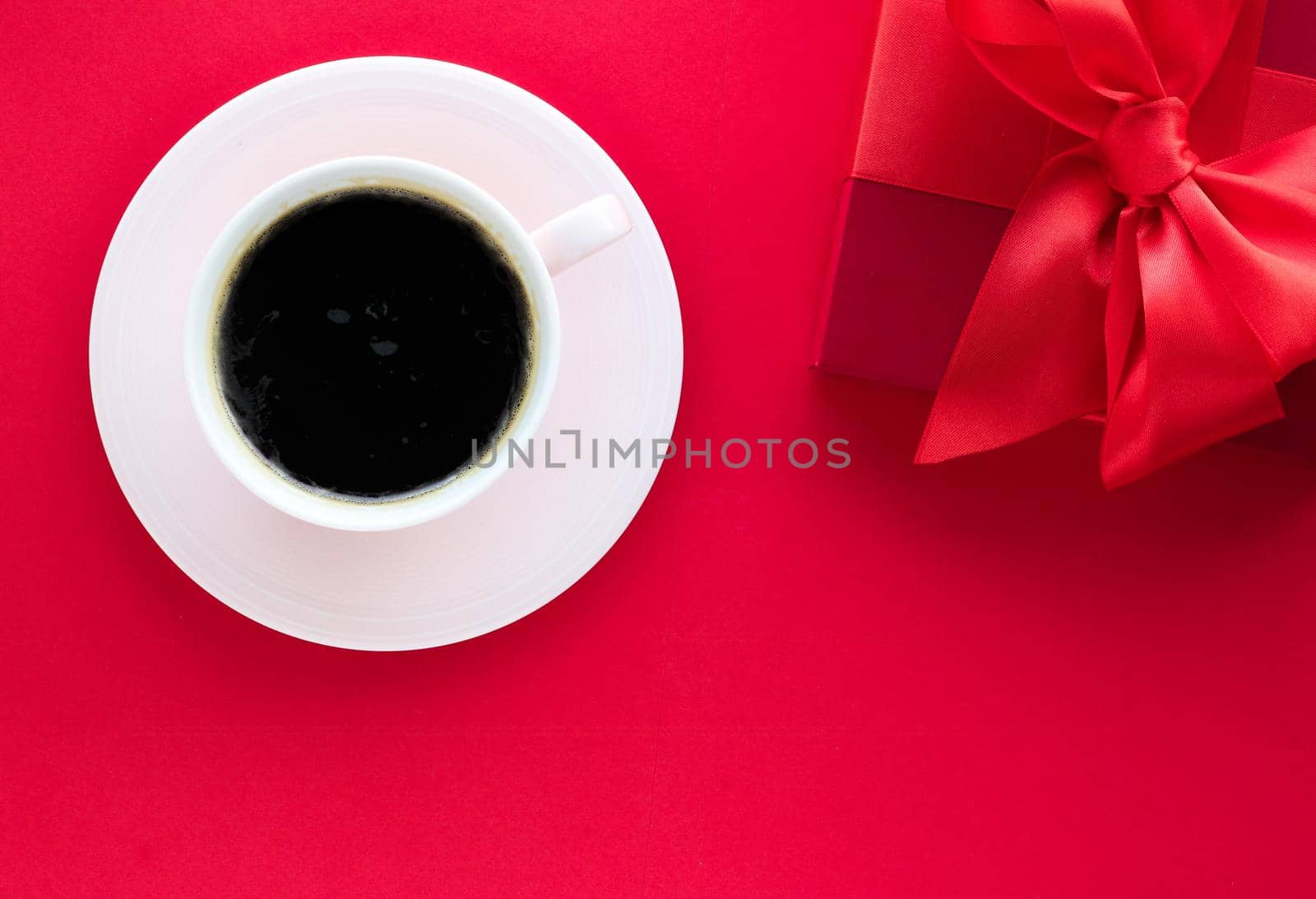 Romantic celebration, lifestyle and birthday present concept - Luxury beauty gift box and coffee on red, flatlay