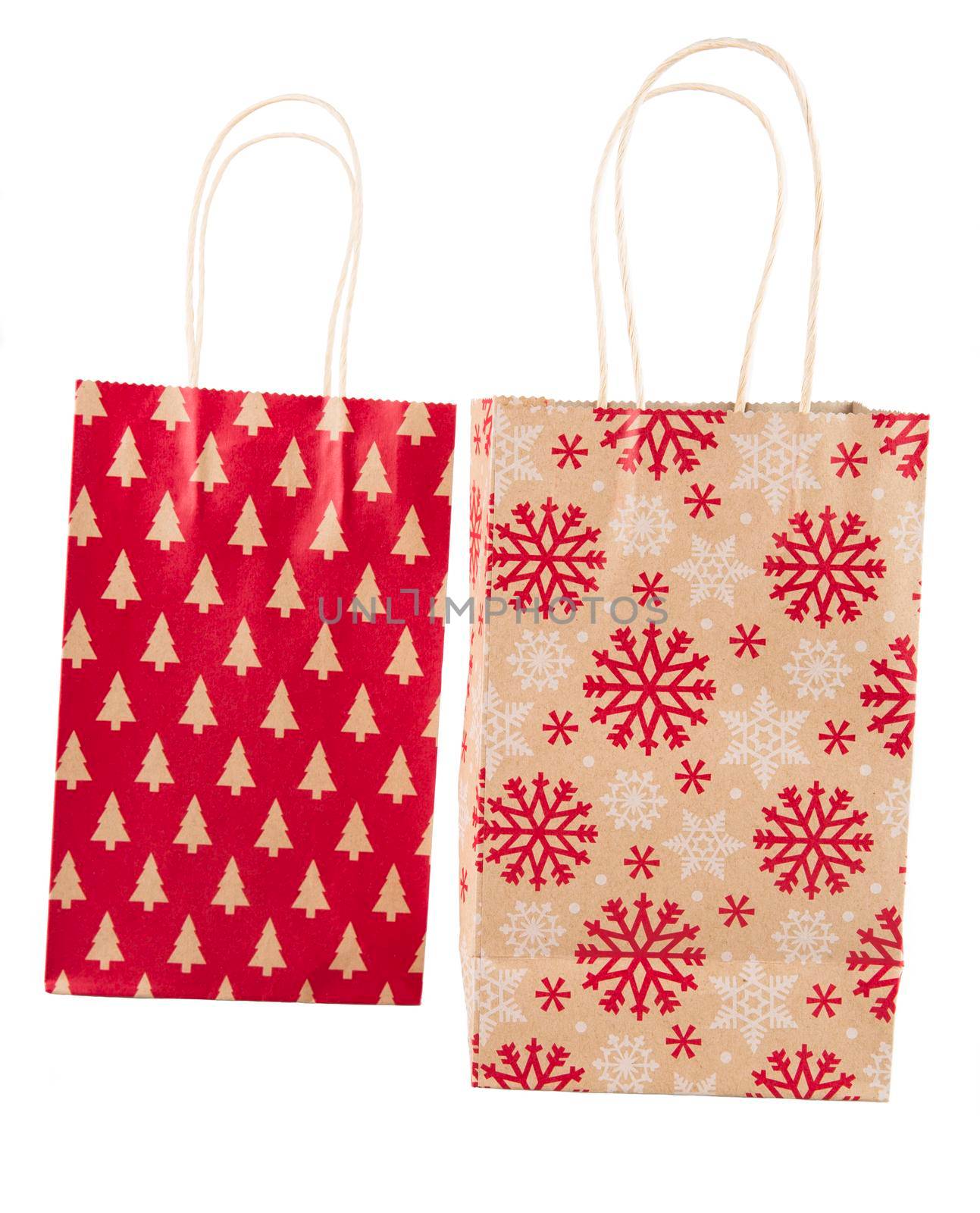 Two holiday gift bags isolated on white background