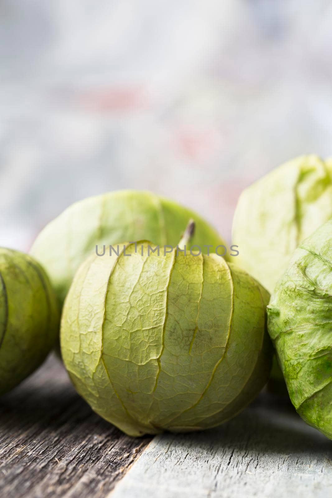 Close up of tomatillos with copy space, vertical orientation.
