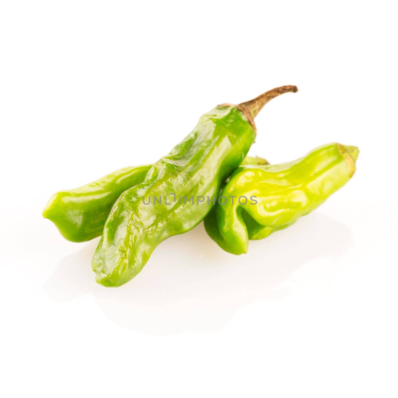 Shishito peppers isolated on a white background with shadow.