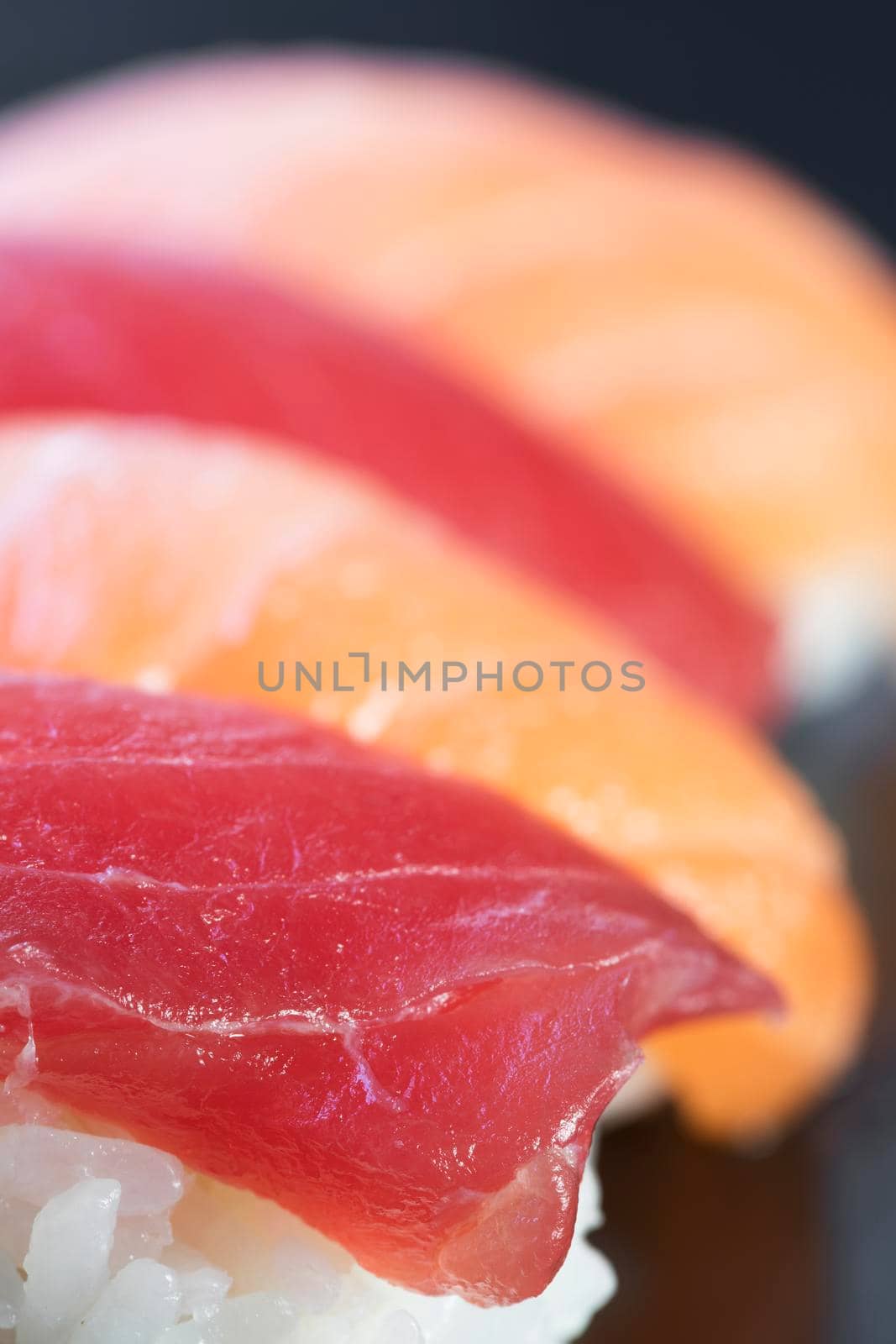 Tuna and salmon nigiri sushi rolls.