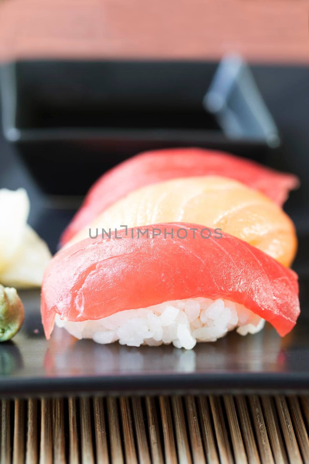 Tuna and salmon nigiri sushi rolls.