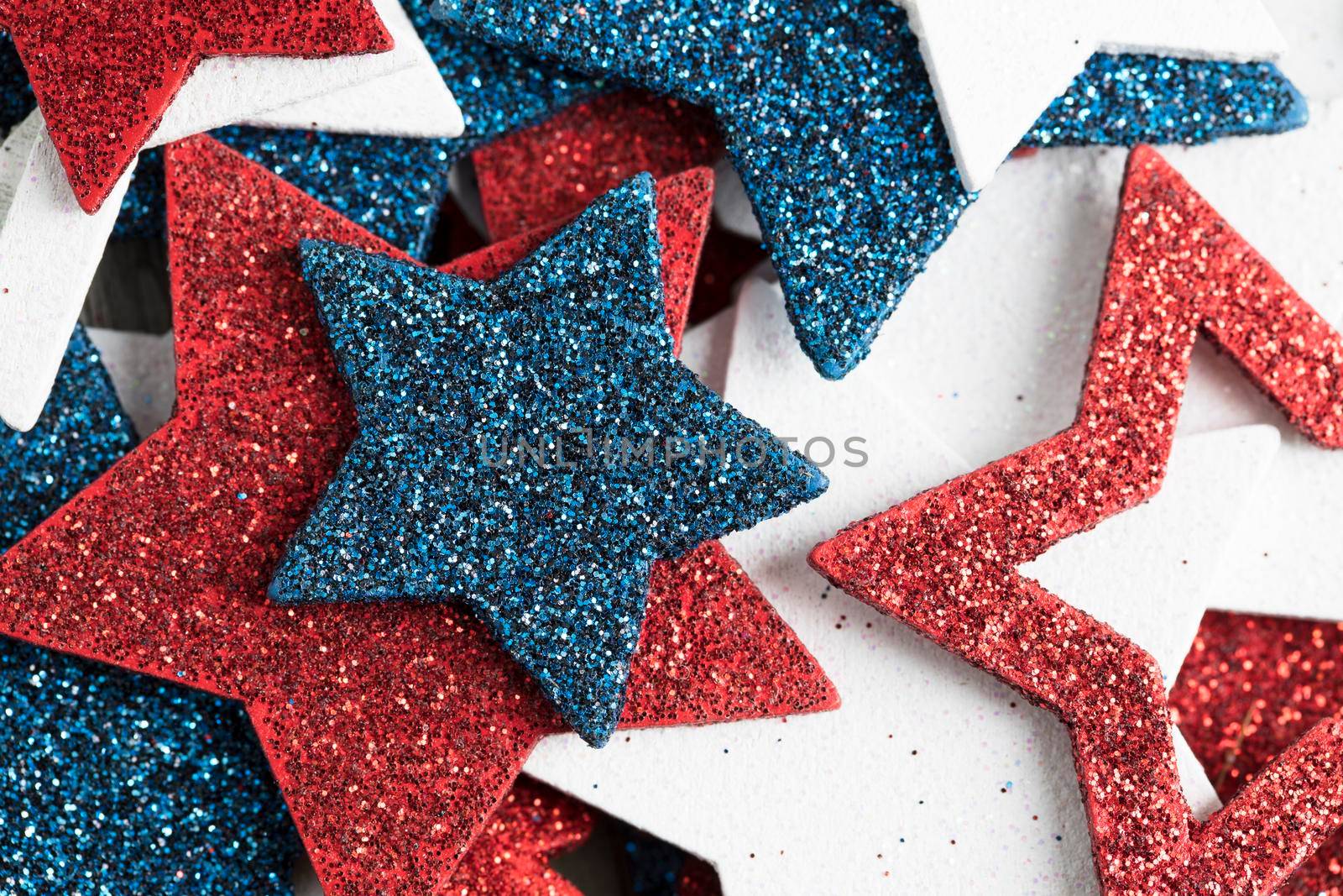 Close up of glitter red white and blue patriotic stars.