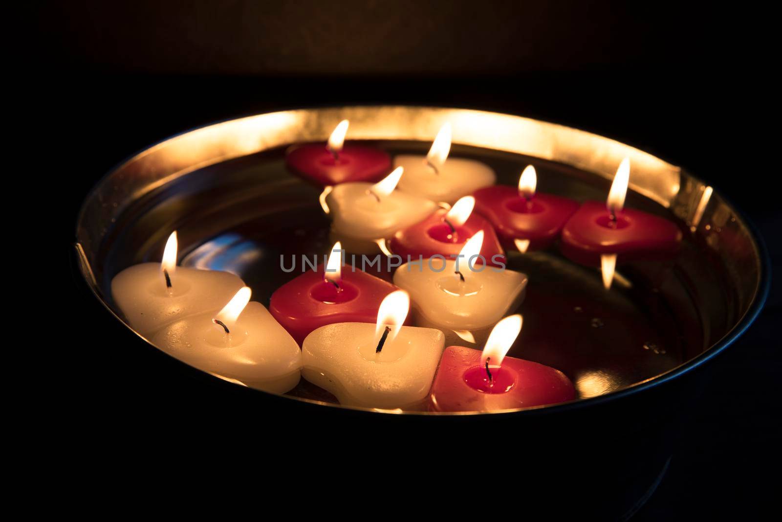 Red and white heart shape floating candles.