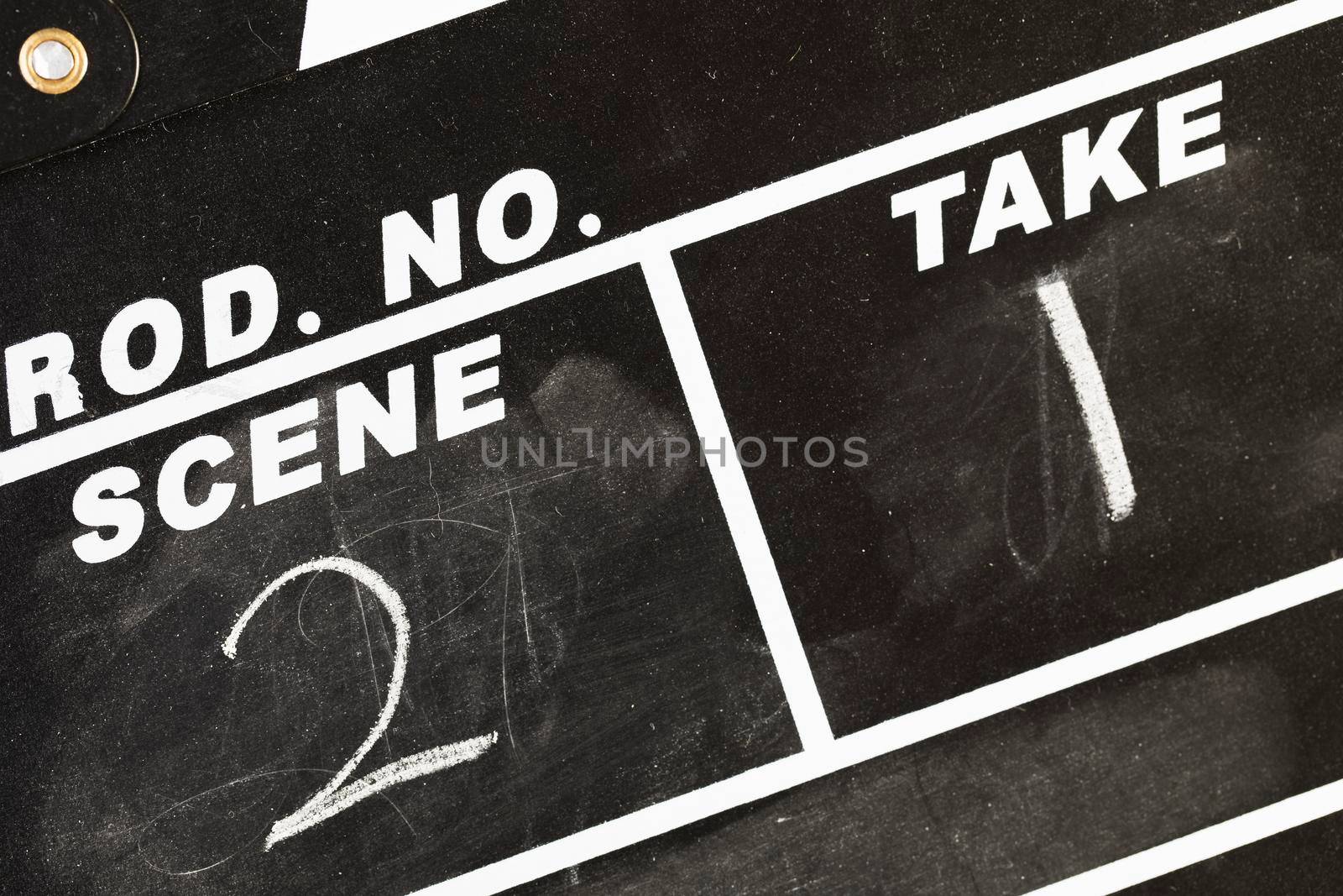 Close up of chalk board film production clapper marked  with scene two, take one.
