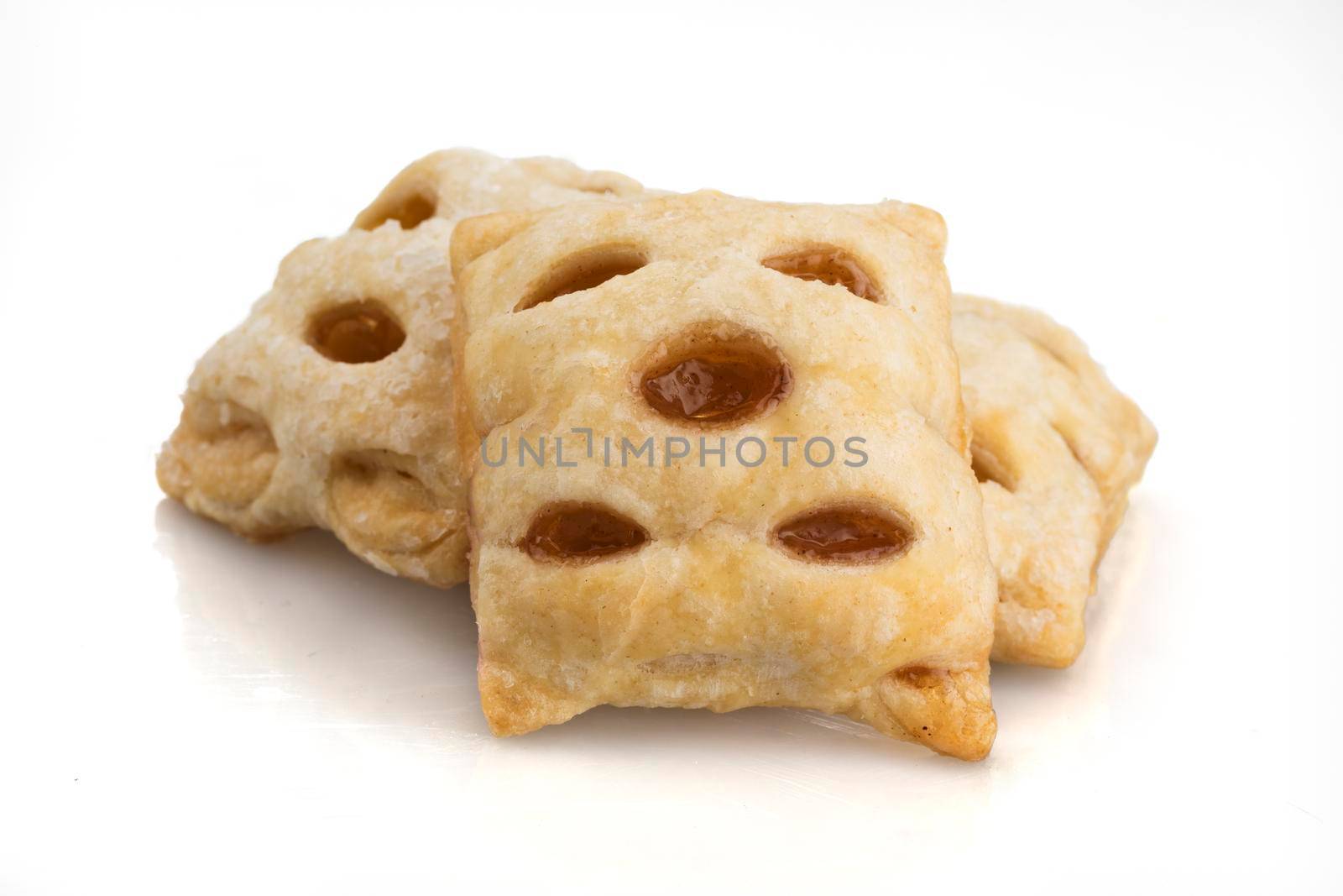 Three apple filled mini strudels on a white background