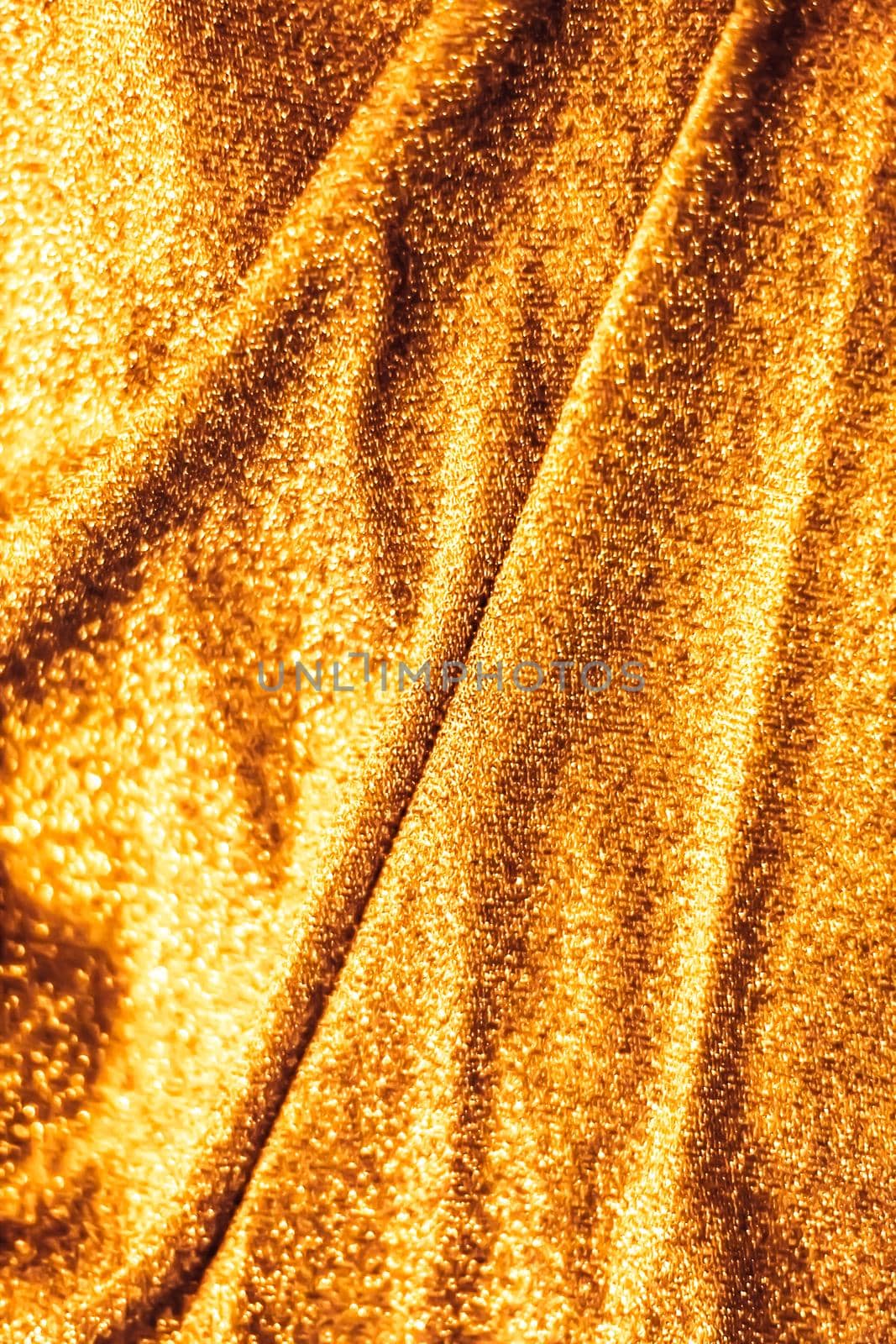 Luxe glowing texture, night club branding and New Years party concept - Golden holiday sparkling glitter abstract background, luxury shiny fabric material for glamour design and festive invitation