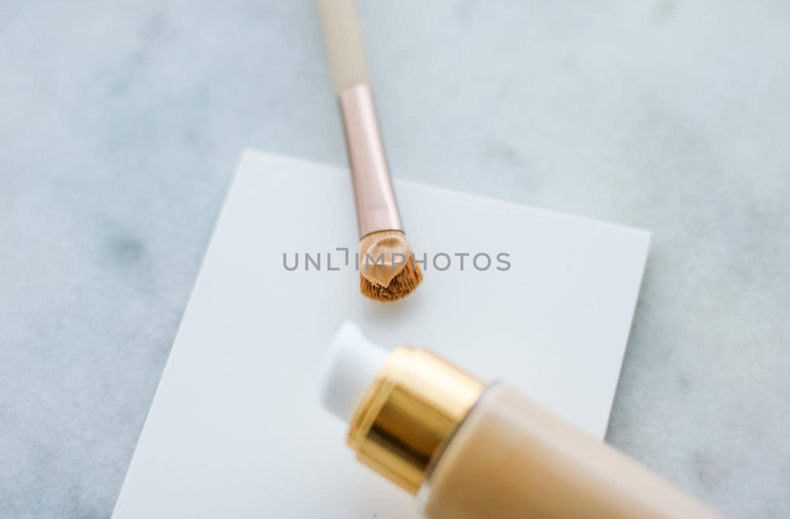 Cosmetic branding, glamour and skincare concept - Makeup foundation bottle and contouring brush on marble, make-up concealer bb cream as cosmetics product for luxury beauty brand holiday design