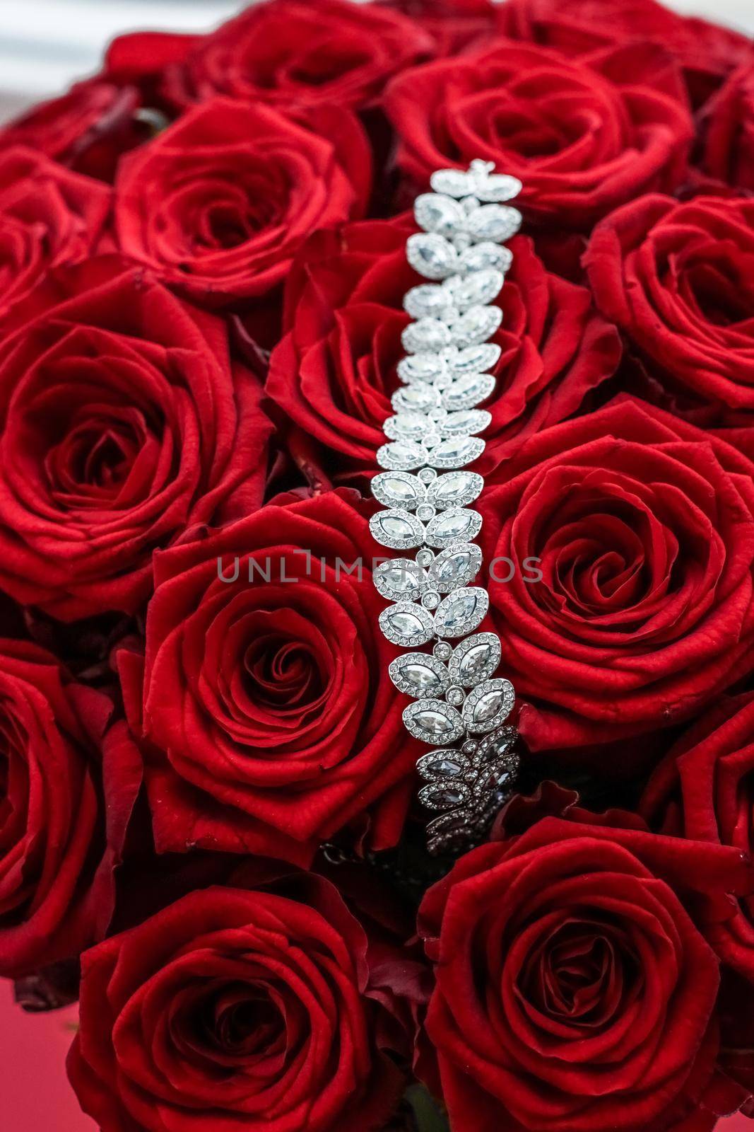 Gemstone jewellery, wedding fashion and luxe shopping concept - Luxury diamond bracelet and bouquet of red roses, jewelry love gift on Valentines Day and romantic holidays present