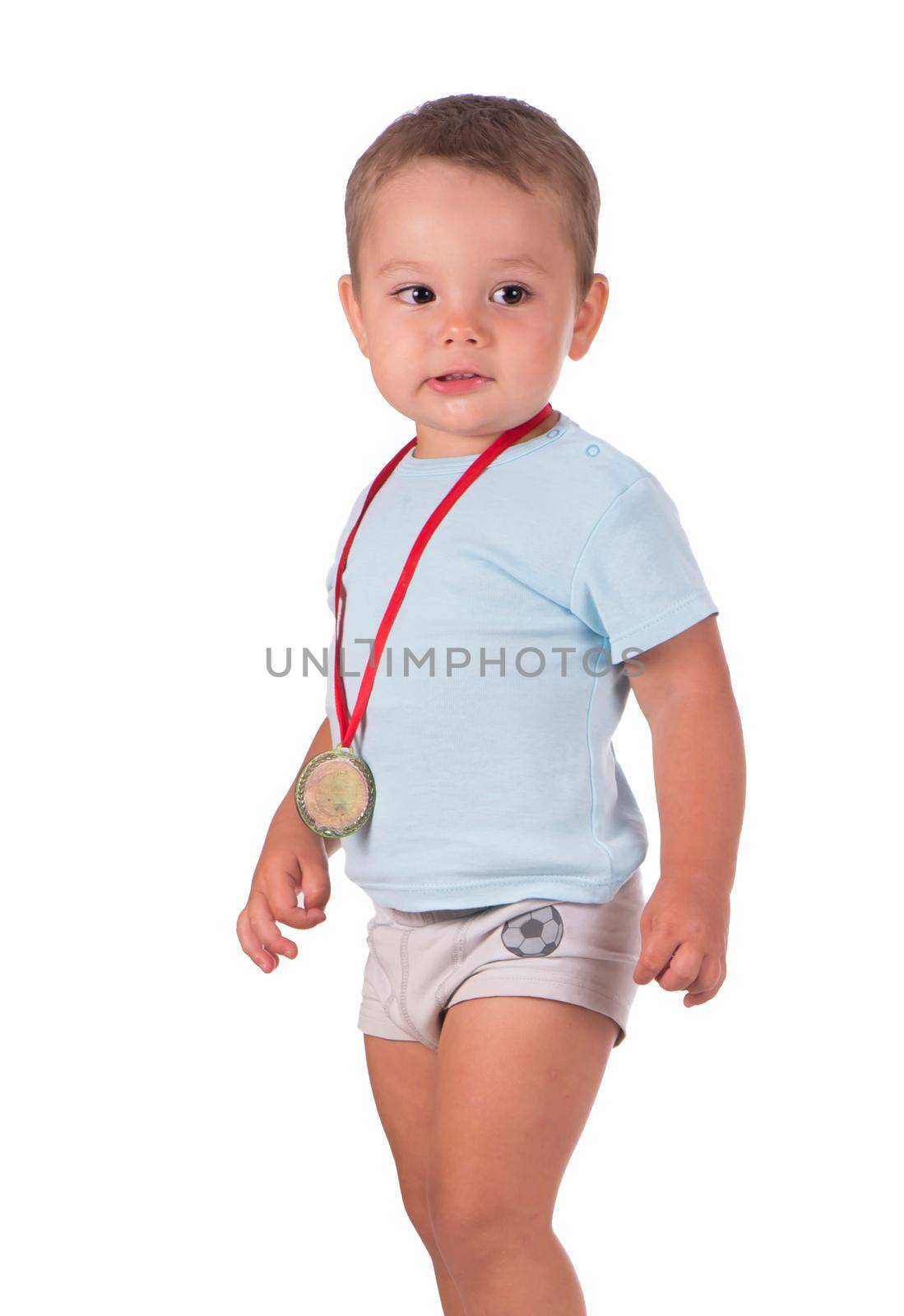 Sports success and victory concept - smiling boy champion, athlete holding first victory gold medal award. by aprilphoto