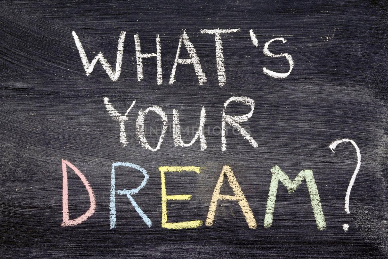 What's your dream? phrase handwritten on chalkboard by color chalk 