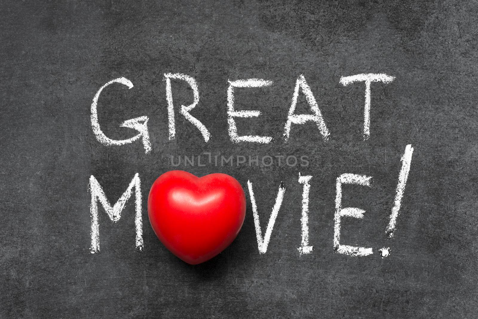 great movie exclamation handwritten on chalkboard with heart symbol instead of O