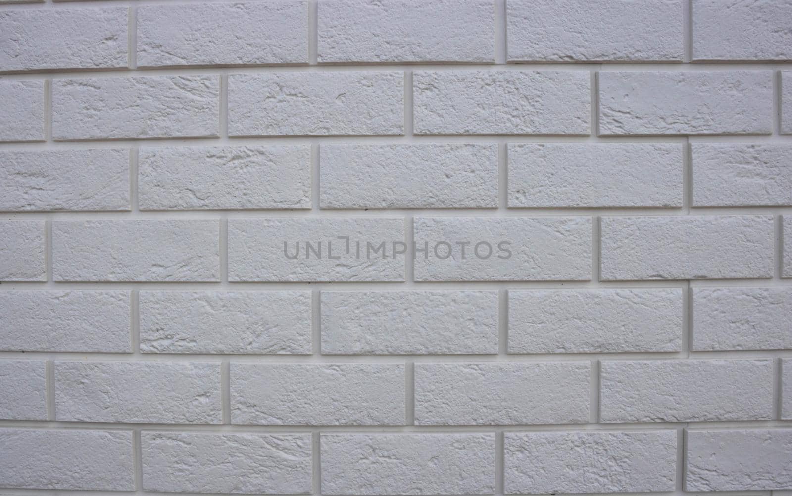 Abstract texture , white brick wall background, rough masonry blocks, architectural wallpaper.