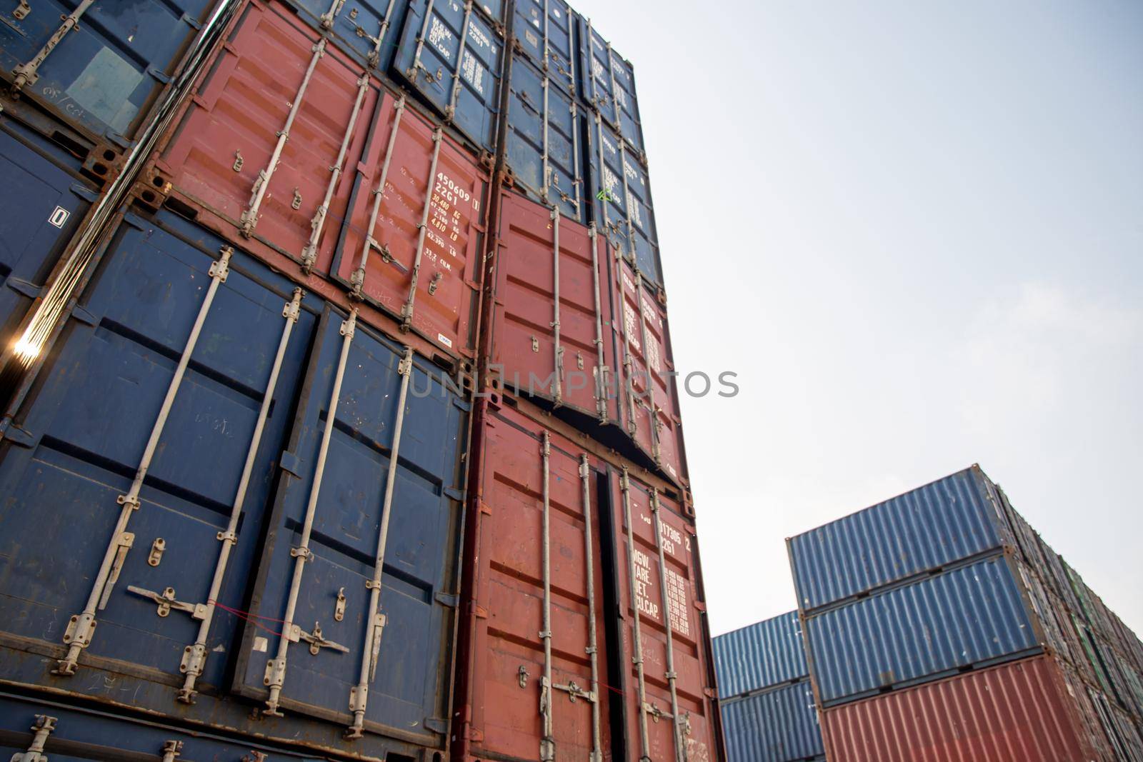 Container Cargo Port Ship Yard Storage Handling of Logistic Transportation Industry. Row of Stacking Containers of Freight Import/Export Distribution Warehouse. Shipping Logistics Transport Industrial, container box in warehouse in shipping port. by chuanchai