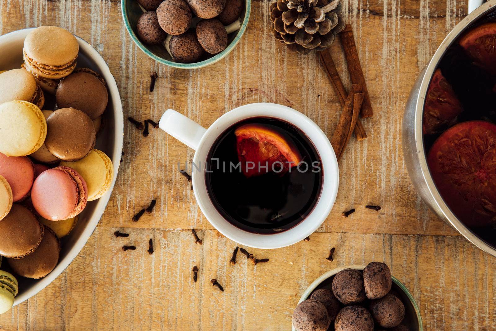 Mug of  delicious hot mulled wine with orange wedge.