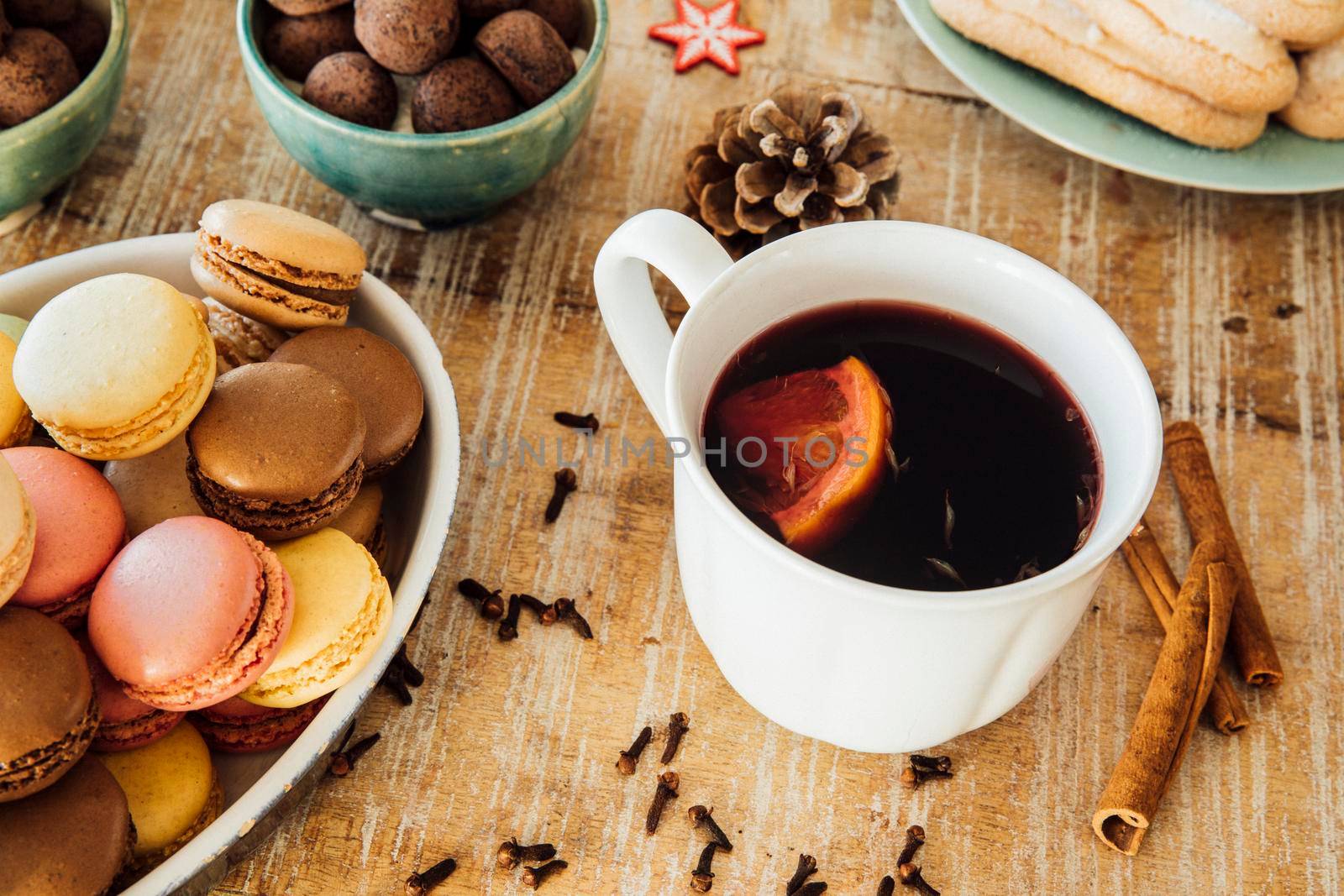 Mug of  delicious hot mulled wine with orange wedge.