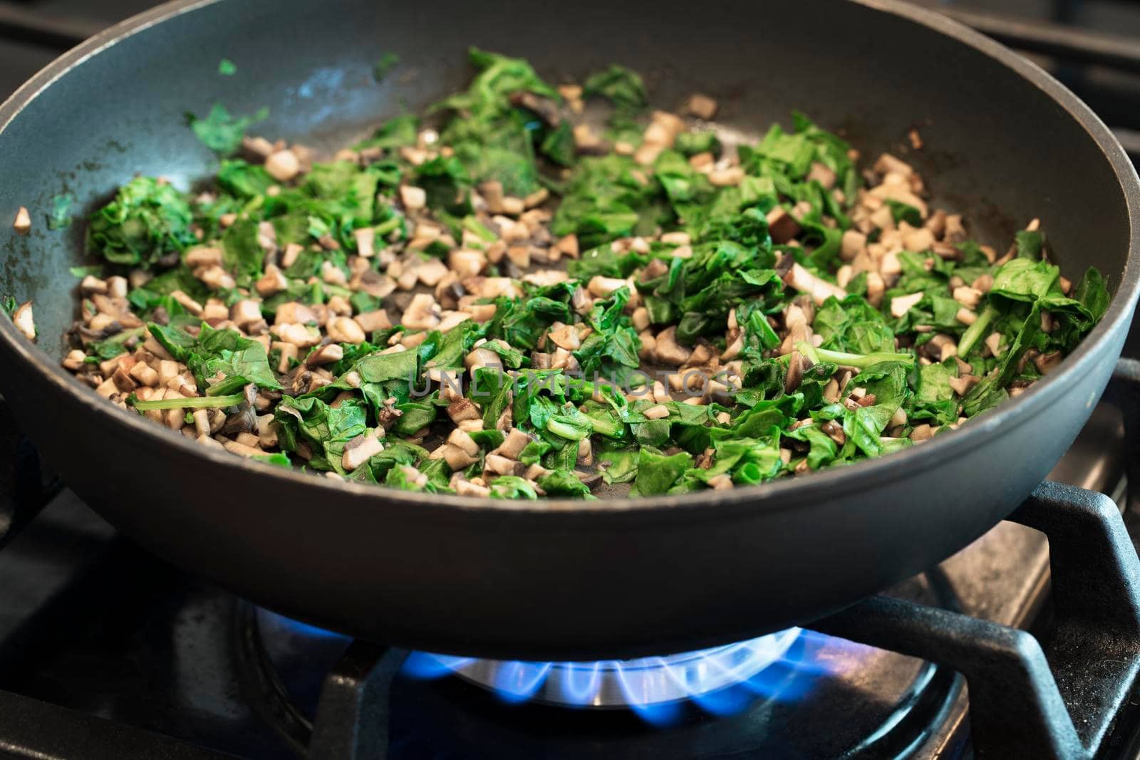 Sautéing Fresh Mushrooms and Spinach by charlotteLake