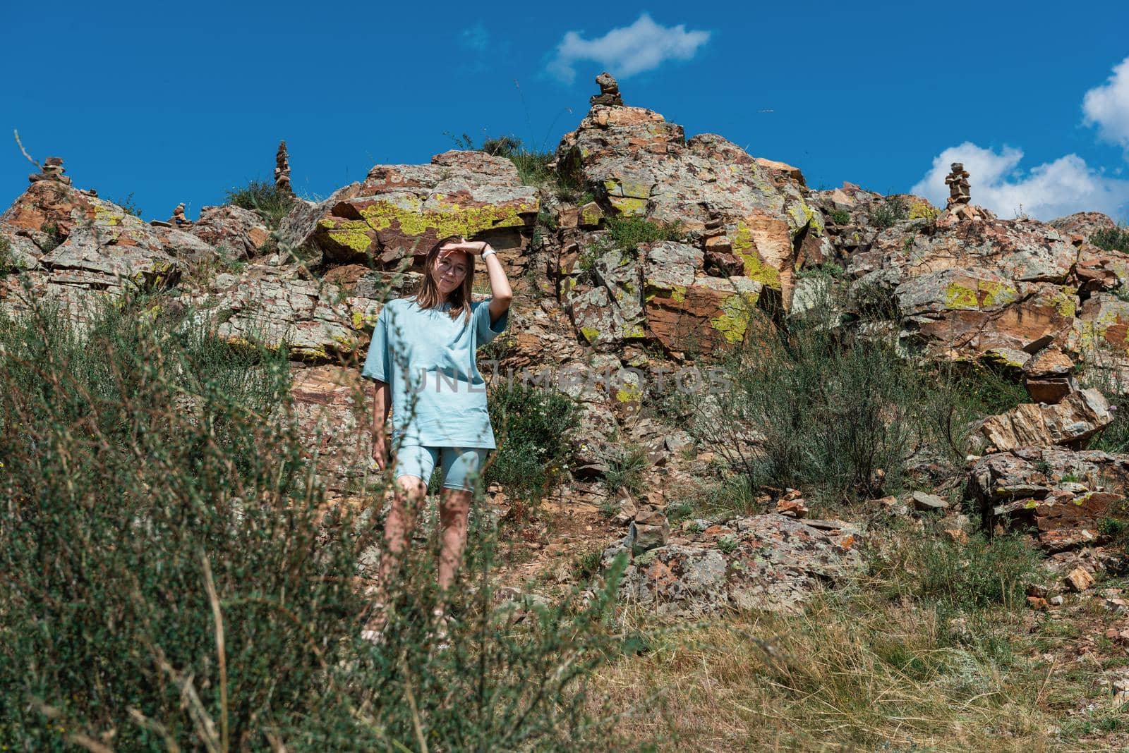 Domestic tourism, travel, lesure concept - woman in Altai mountains, beauty summer day