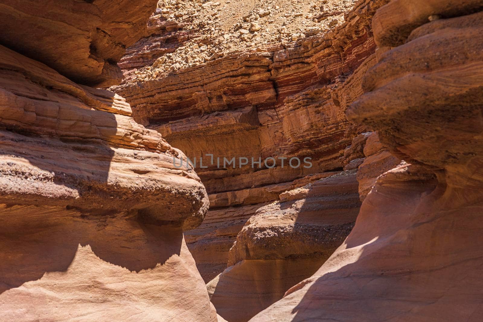 An amazing place in Israel is called the Red canyon and Nahal Shani, Southern District. Totally worth visiting because of its stunning stony structure. High quality photo