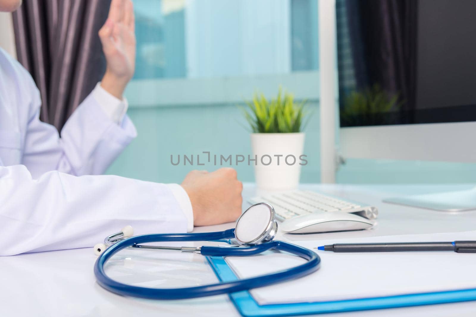 Medicine doctor's working on desk. Closeup of Stethoscope by Sorapop