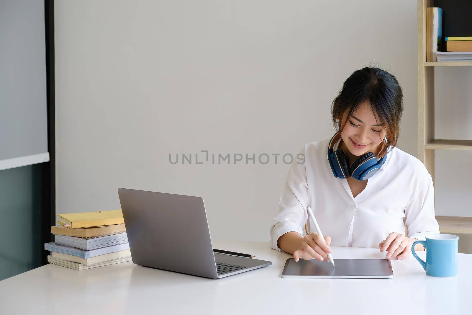 A girl practice basic course exercises by video on laptop before online class. Social distancing.stay home. New normal. Covid-19 coronavirus concept.