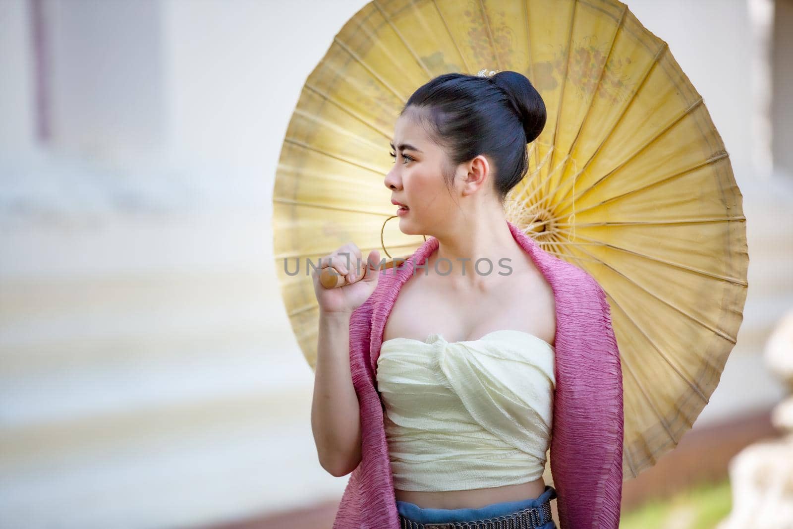 Lanna woman north thailand, Thailand or Thai costume Asian dress concept. Young Thai beautiful woman is walking in the Buddhist temple in Ayutthaya.