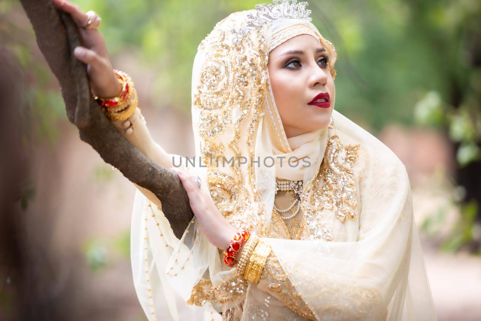 Portrait Of Young Bride Wearing wedding Hijab Standing outdoor by chuanchai