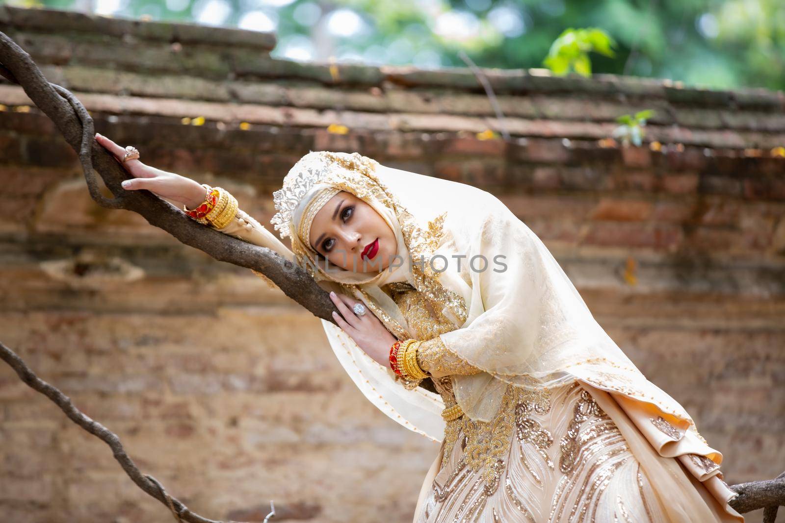 Portrait Of Young Bride Wearing wedding Hijab Standing outdoor by chuanchai