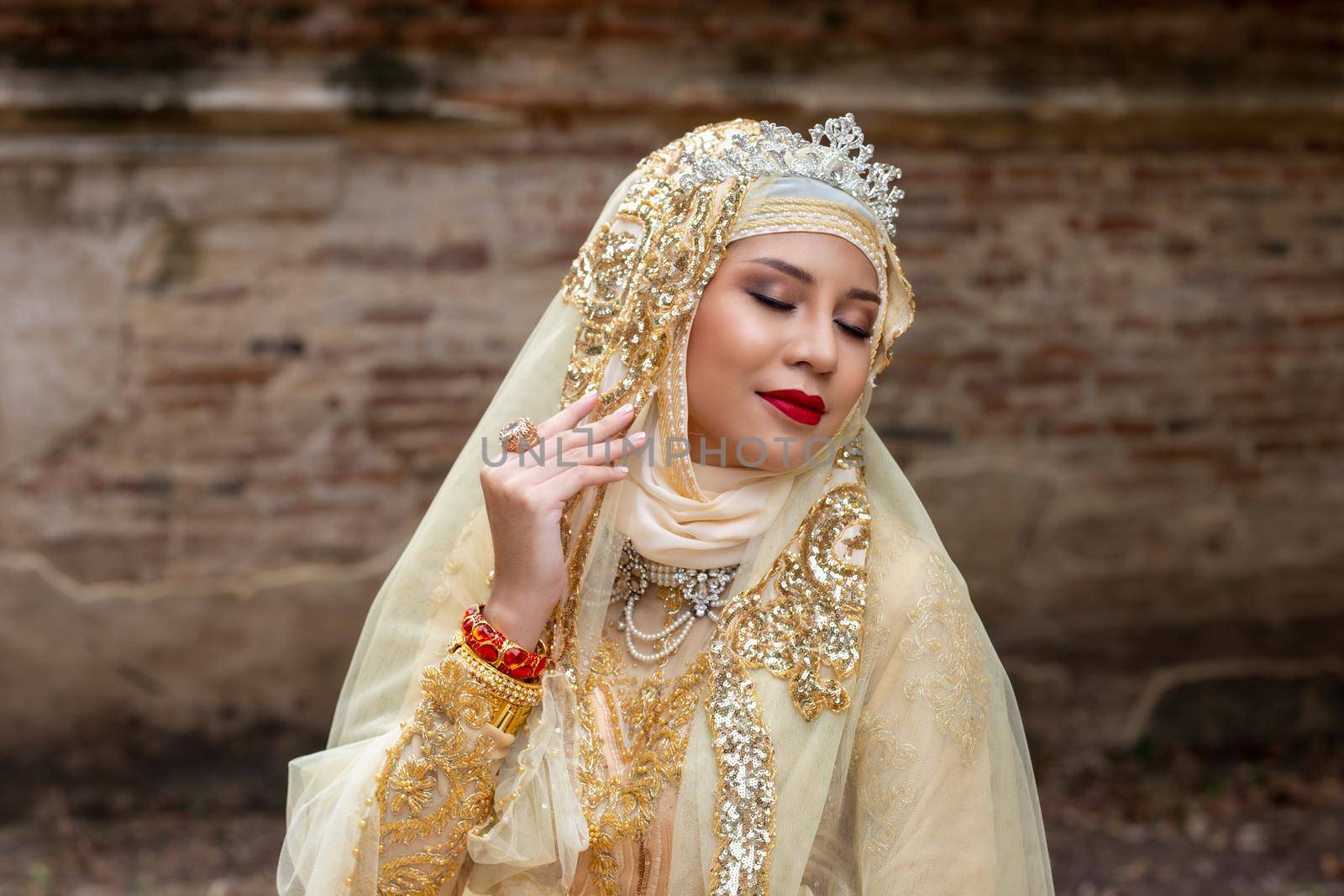 Portrait Of Young Bride Wearing wedding Hijab Standing outdoor by chuanchai