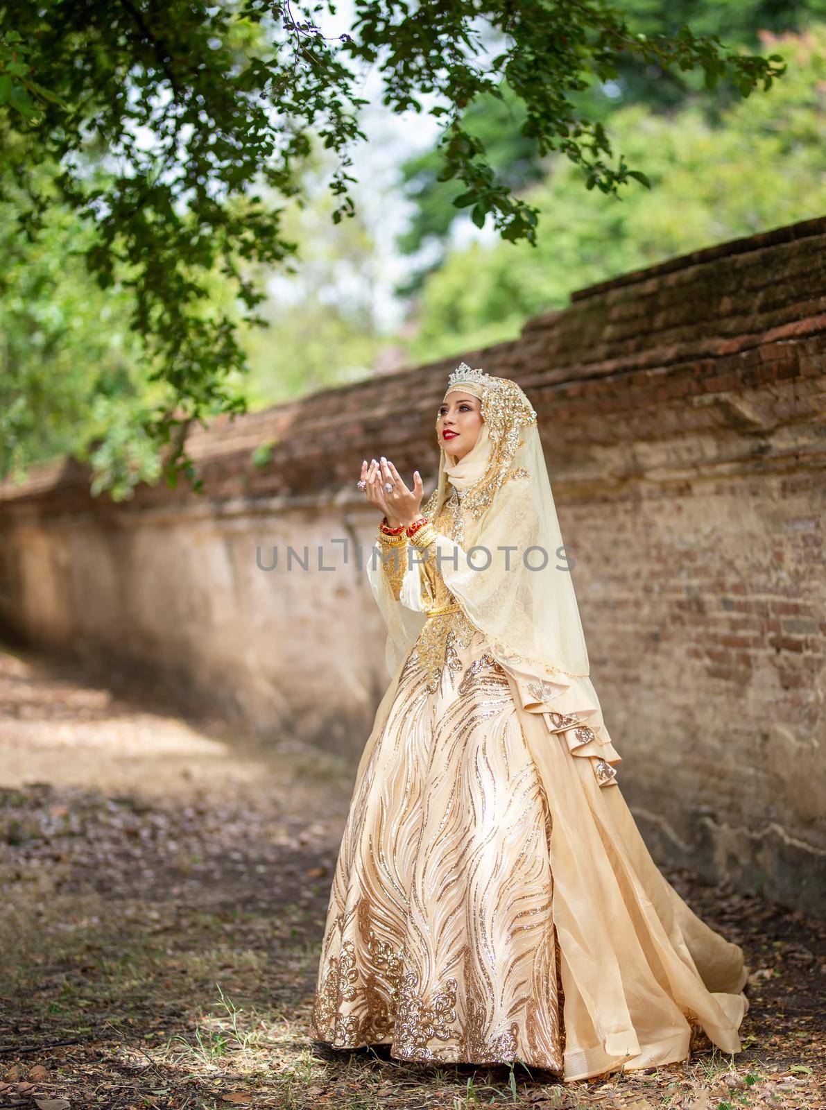 Portrait Of Young Bride Wearing wedding Hijab Standing outdoor by chuanchai