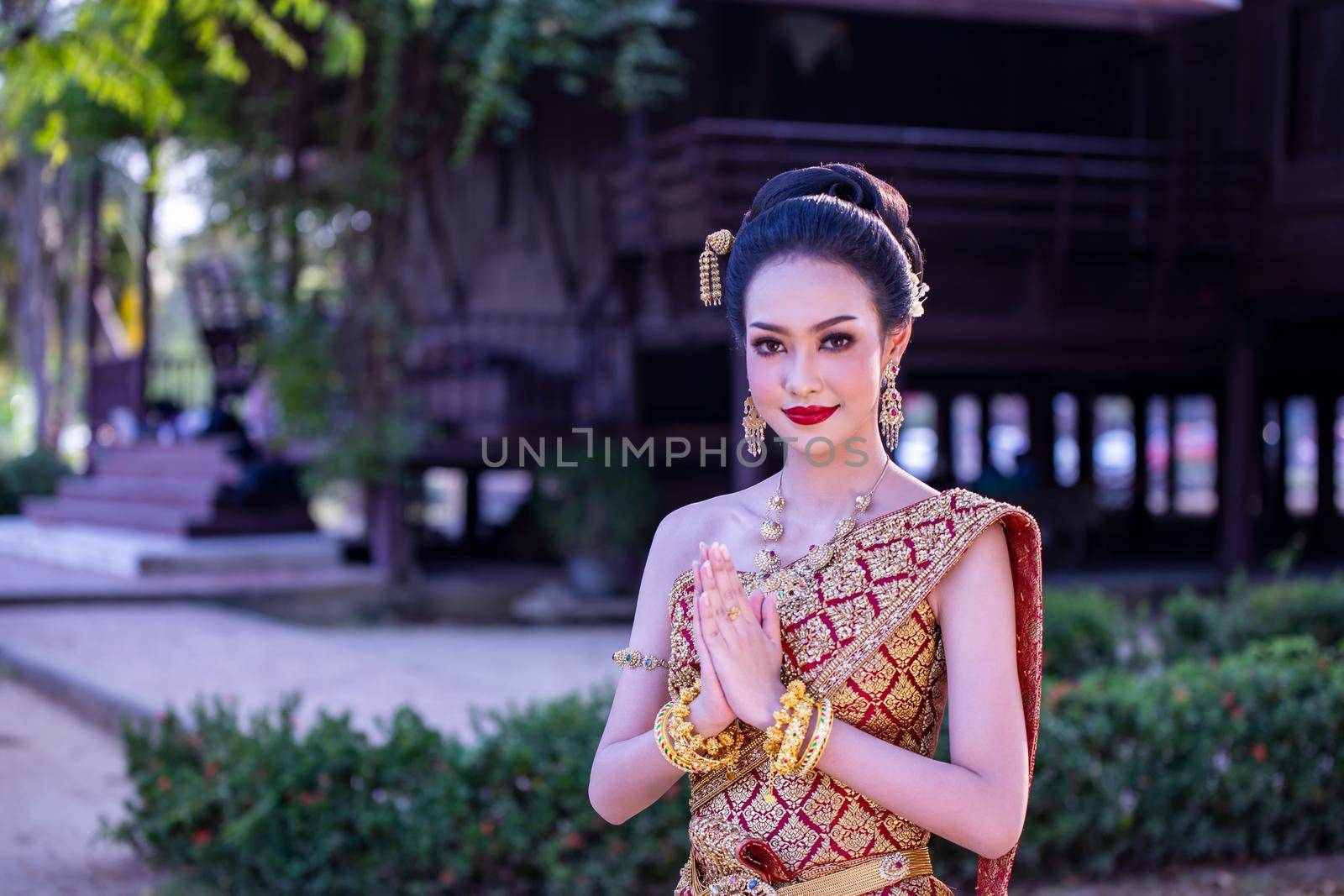 Beautiful woman, Thai national costume, traditional Thai dress, Thai woman, good mood, beautiful smile background - Image with noise and grain