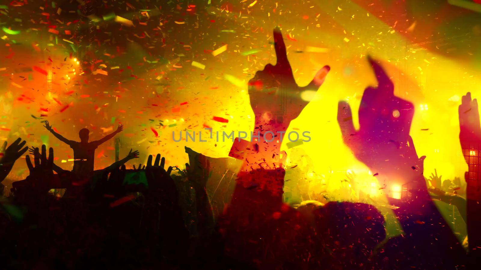 Concert Music festival and Celebrate. Party People Rock Concert. Crowd Happy and Joyful and Applauding or Clapping. Celebration party festival happiness. Blurry night club. Concert Show with DJ Music festival EDM on Stage by chuanchai