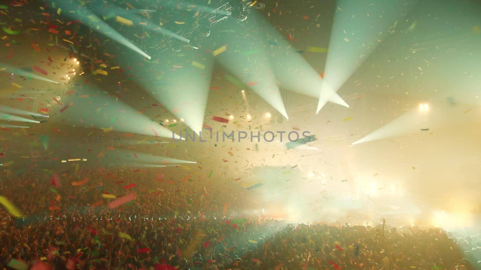 Concert Music festival and Celebrate. Party People Rock Concert. Crowd Happy and Joyful and Applauding or Clapping. Celebration party festival happiness. Blurry night club. Concert Show with DJ Music festival EDM on Stage by chuanchai