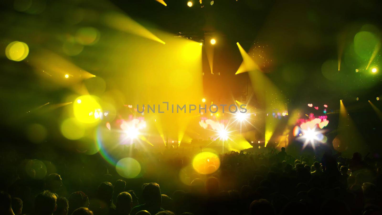 Concert Music festival and Celebrate. Party People Rock Concert. Crowd Happy and Joyful and Applauding or Clapping. Celebration party festival happiness. Blurry night club. Concert Show with DJ Music festival EDM on Stage