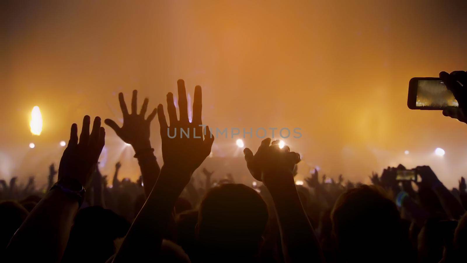 Concert Music festival and Celebrate. Party People Rock Concert. Crowd Happy and Joyful and Applauding or Clapping. Celebration party festival happiness. Blurry night club. Concert Show with DJ Music festival EDM on Stage by chuanchai