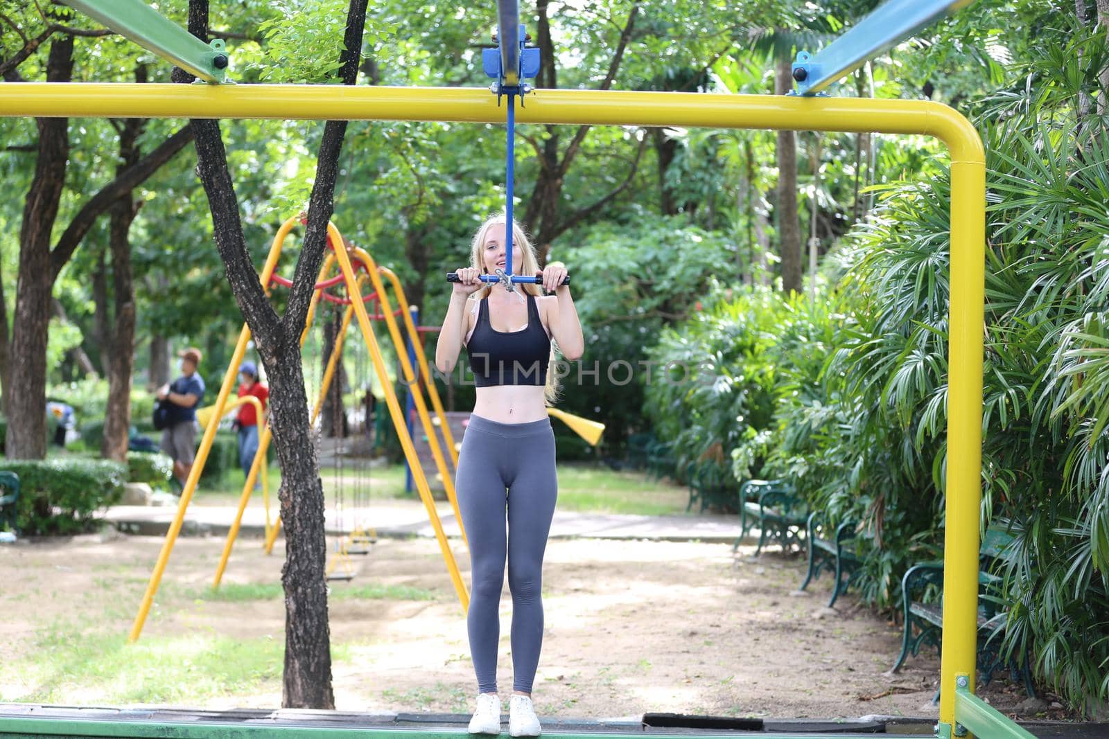 beautiful young woman doing sports and excercise.  by chuanchai